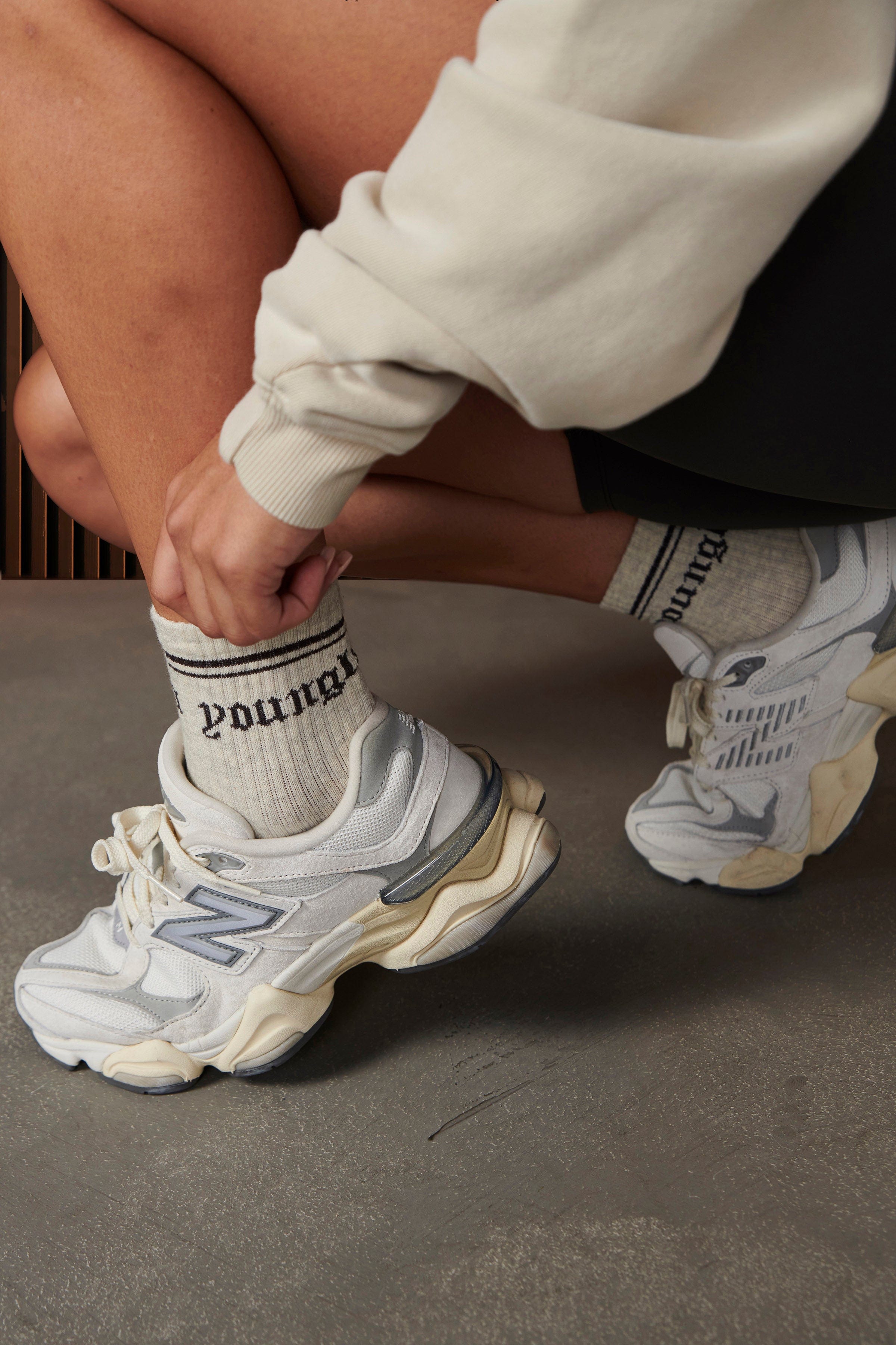 Three pairs of crew socks folded together, showcasing the neutral color palette