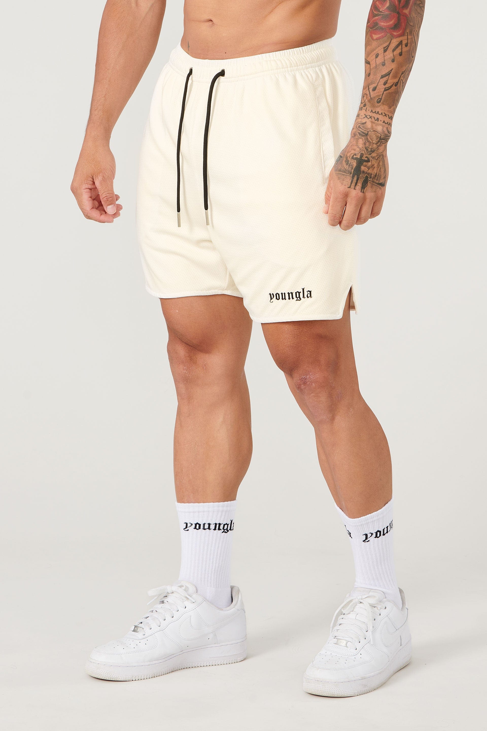 Athletic socks paired with game shorts for a complete sports look