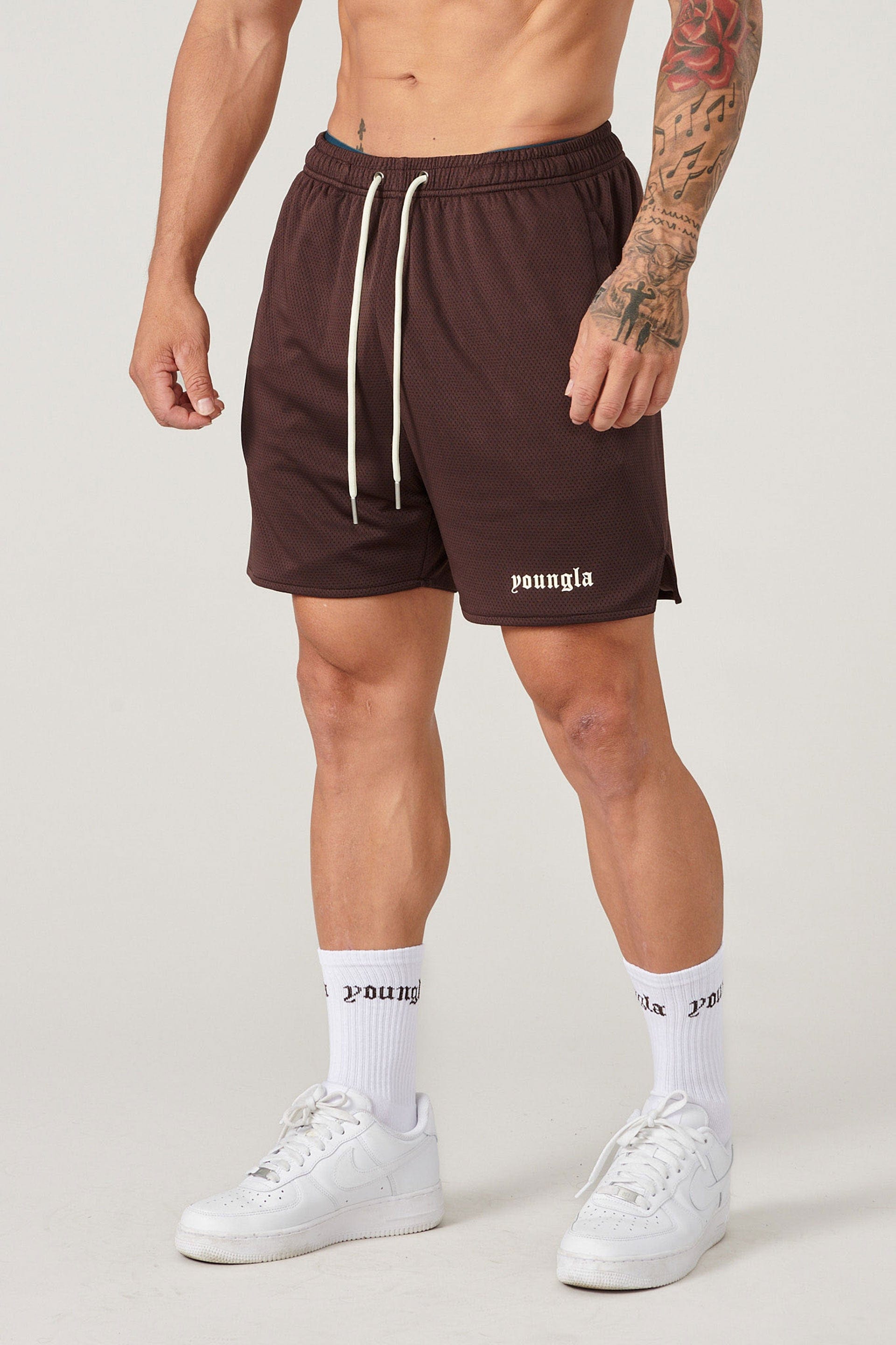 Player wearing matching shorts and socks during a basketball game