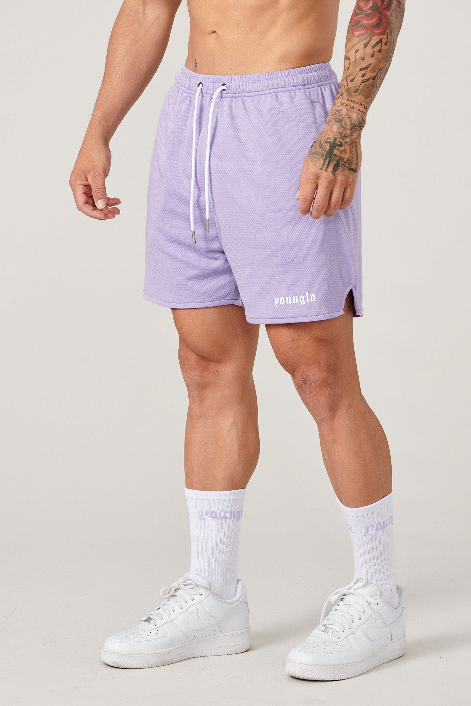 Close-up of mens basketball shorts with breathable mesh fabric