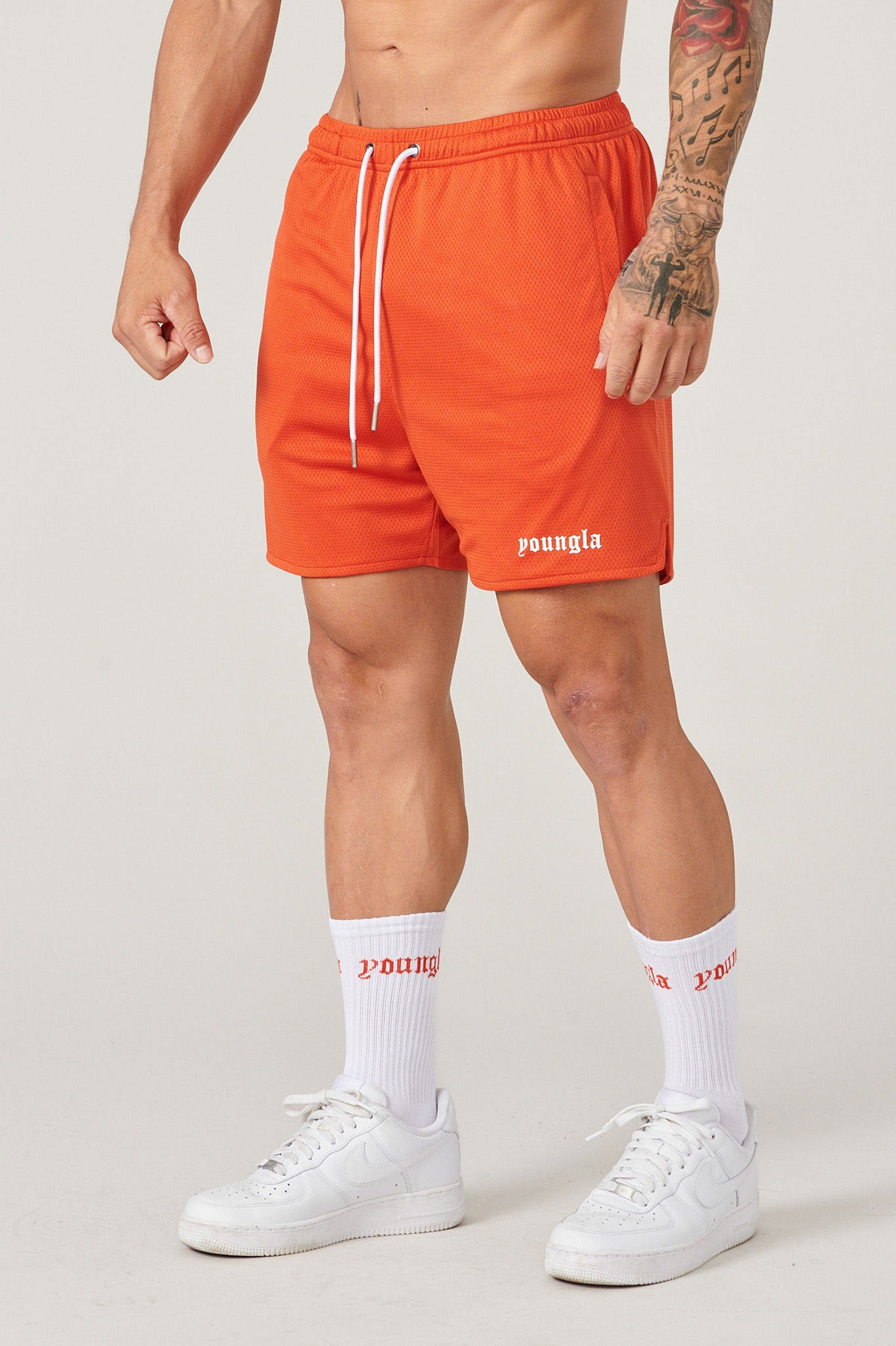Athletic socks paired with game shorts for a complete sports look