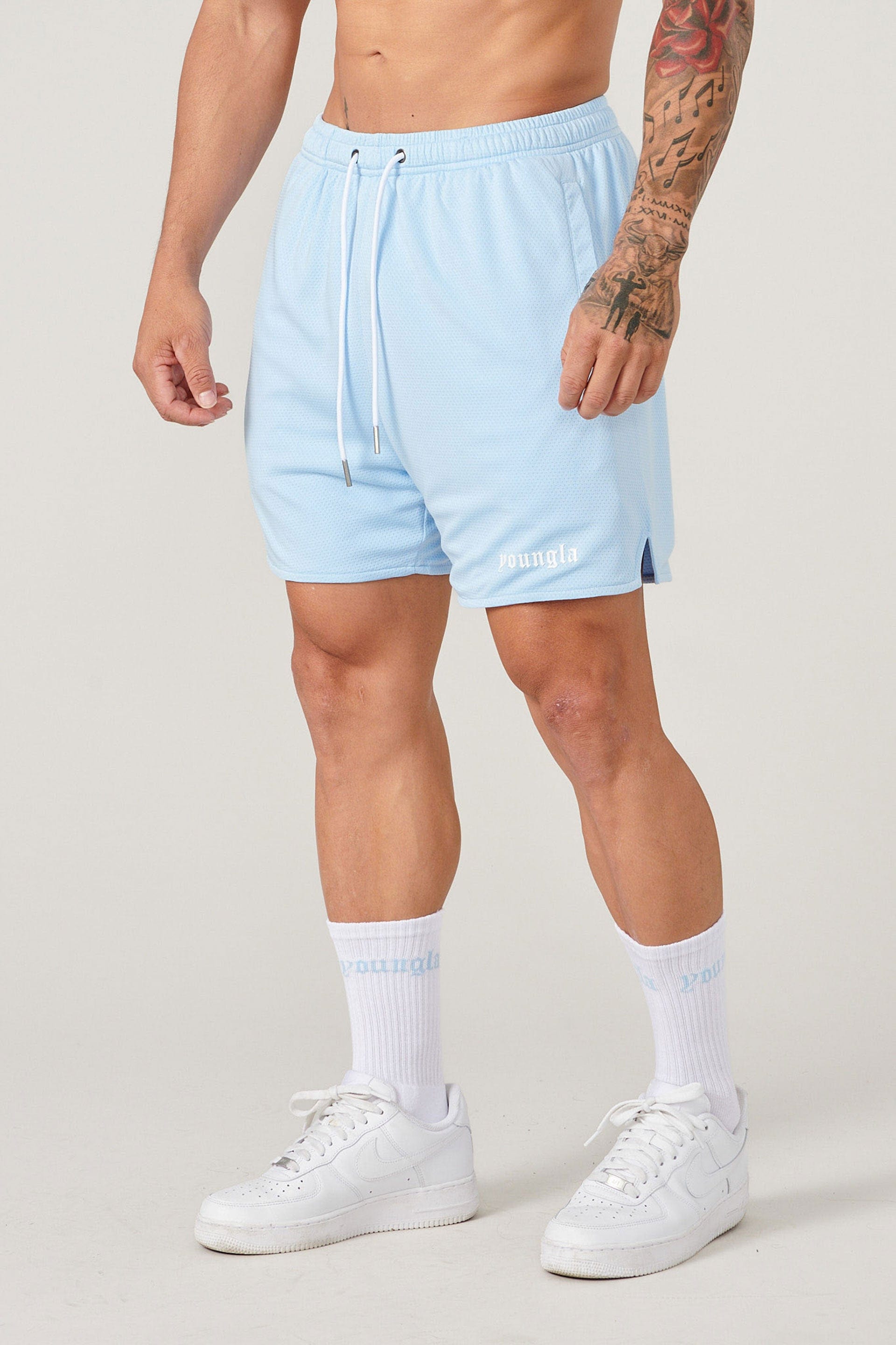 Close-up of mens basketball shorts with breathable mesh fabric
