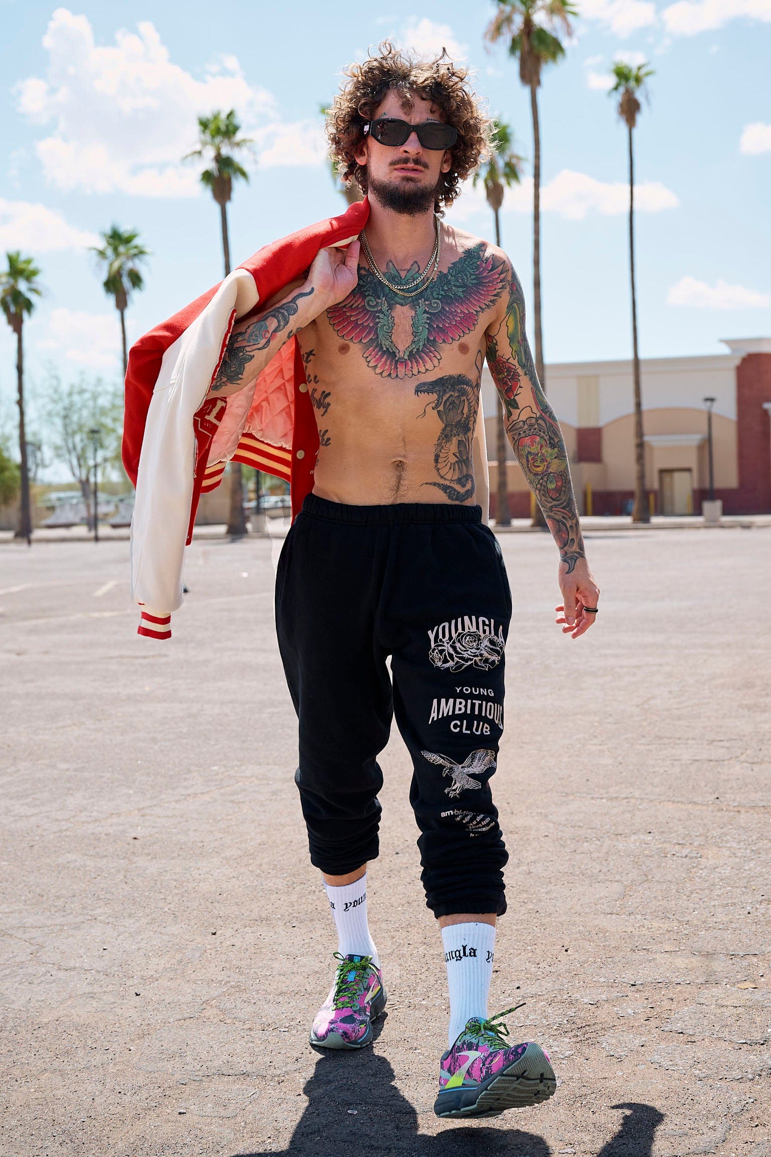 Joggers for women styled casually in urban outdoor setting with sneakers