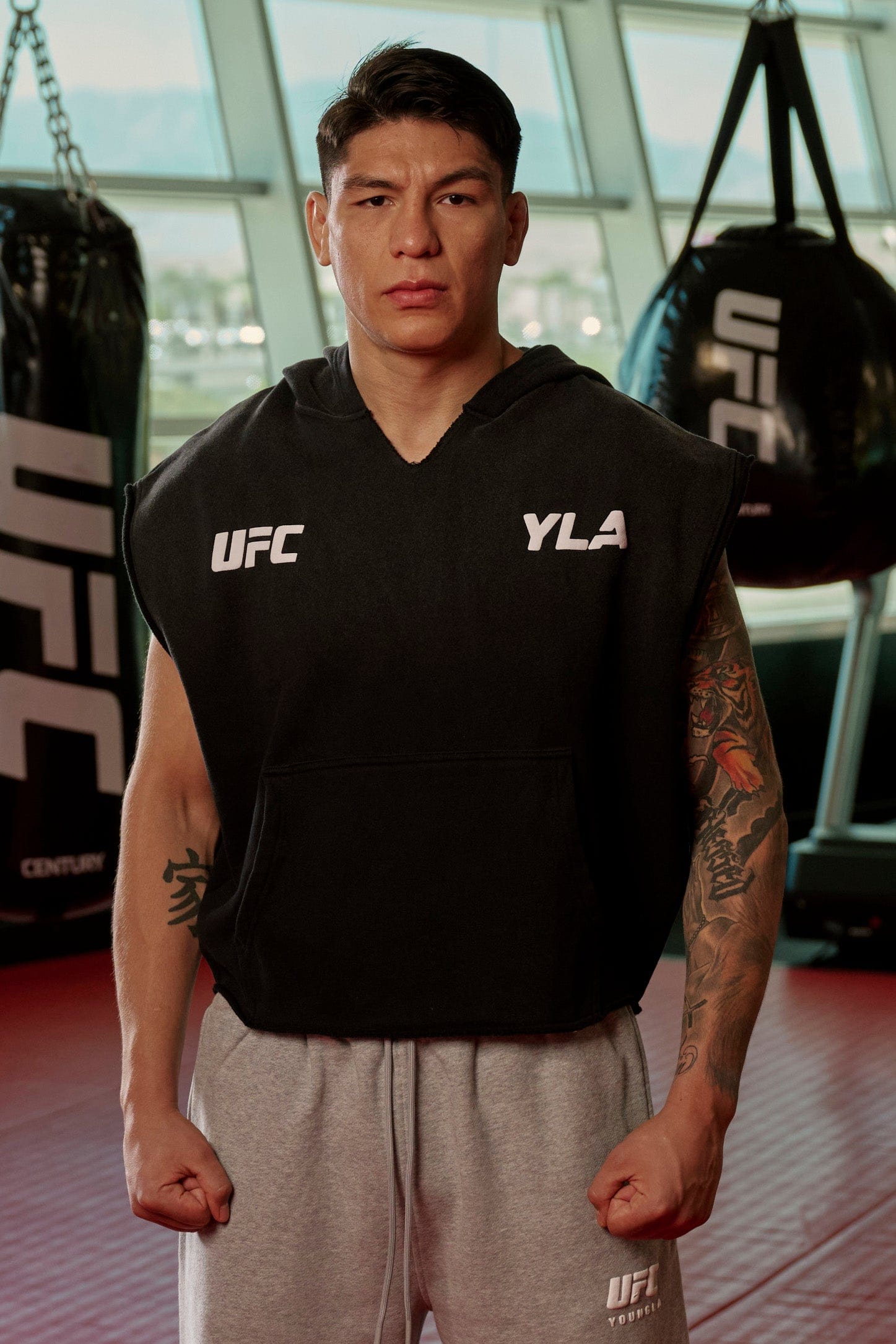 Side angle of the UFC hoodie highlighting sleeveless design.