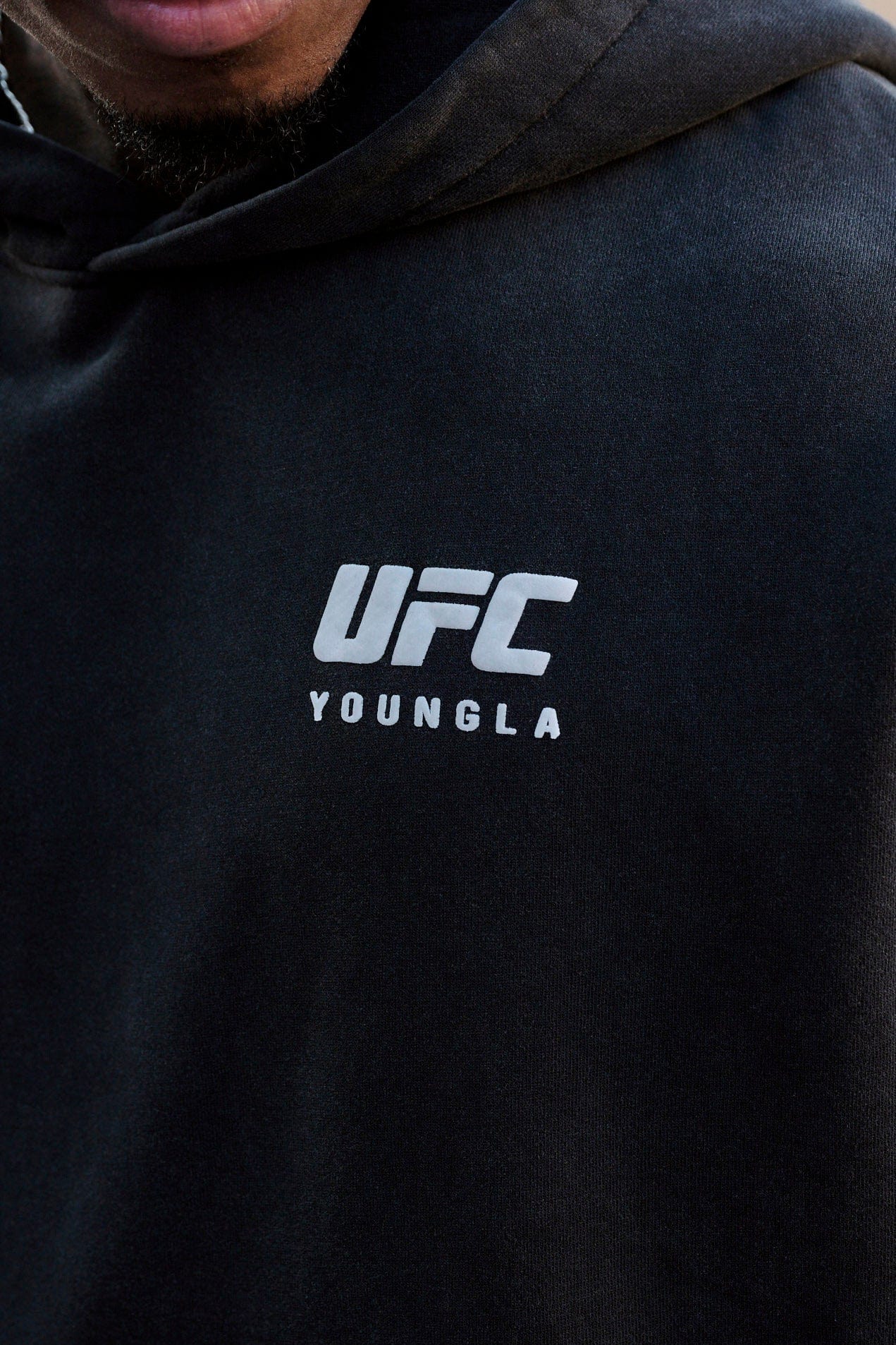 Front view of UFC oversized hoodie showcasing distressed logos.