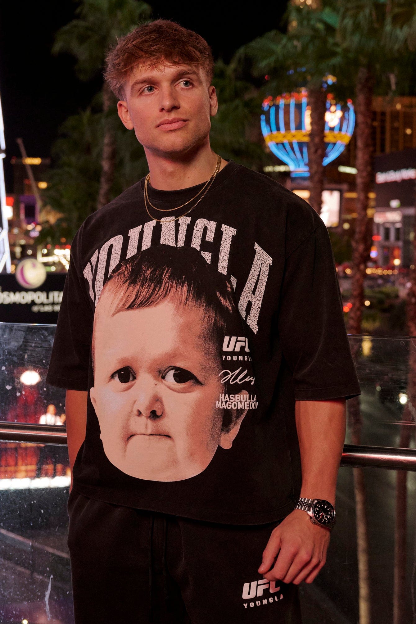 Front angle of fight club tee with bold fighter face print, worn casually