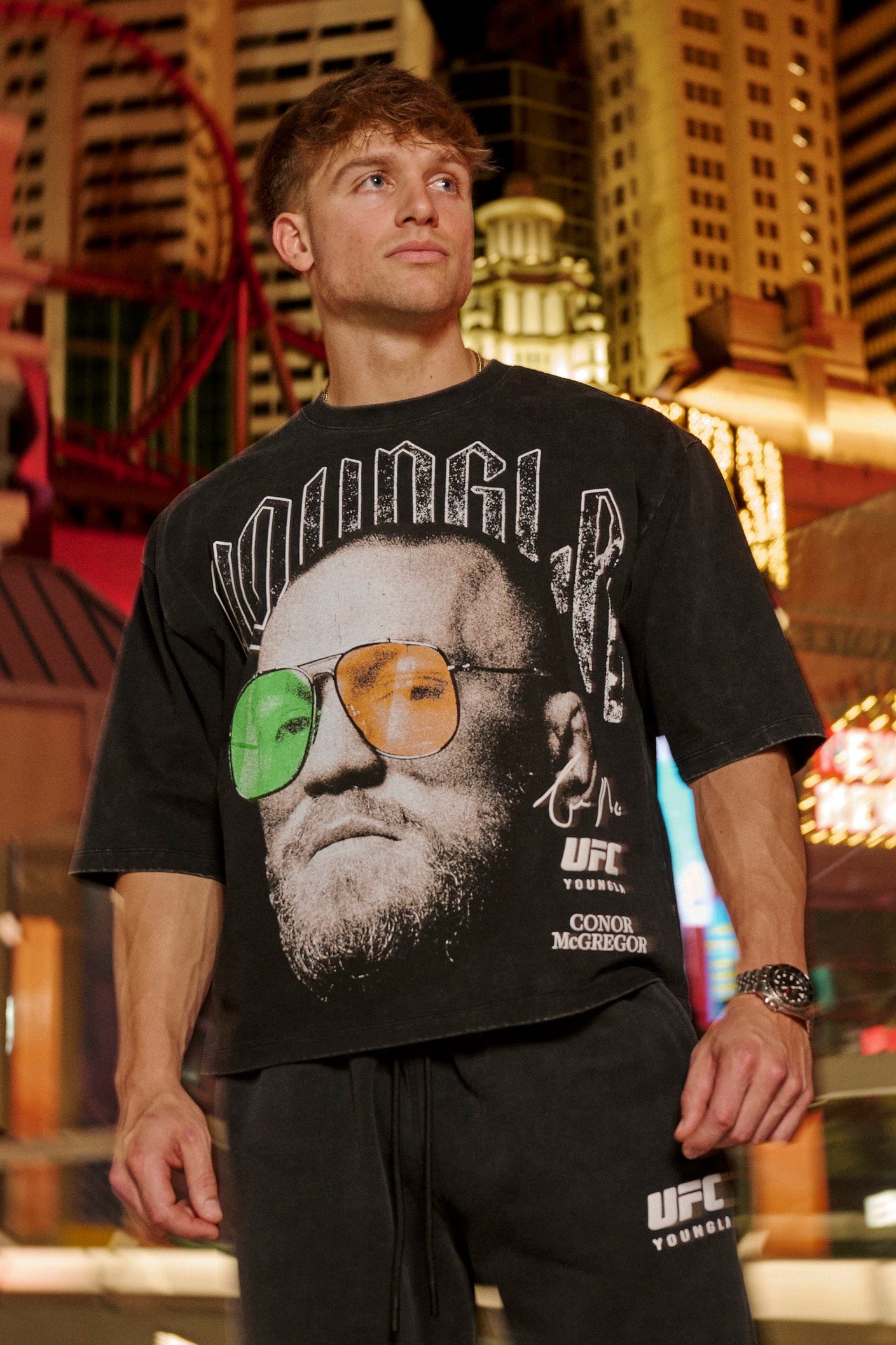 Front angle of fight club tee with bold fighter face print, worn casually