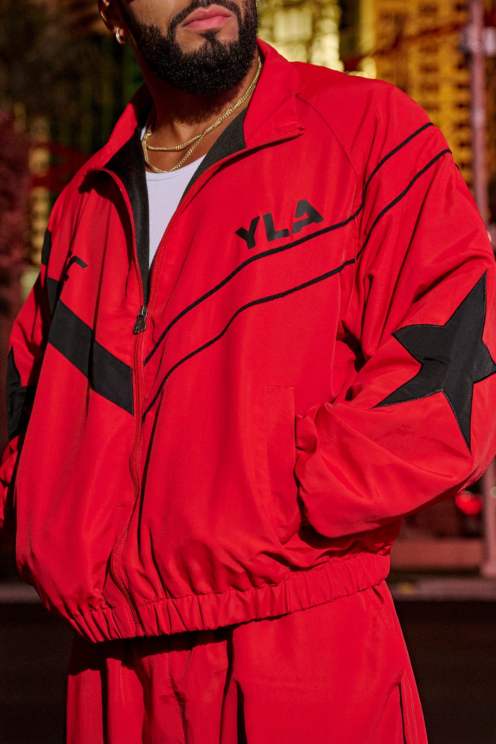 Model wearing the UFC™ tracksuit jacket, perfect for casual outings or gym sessions.