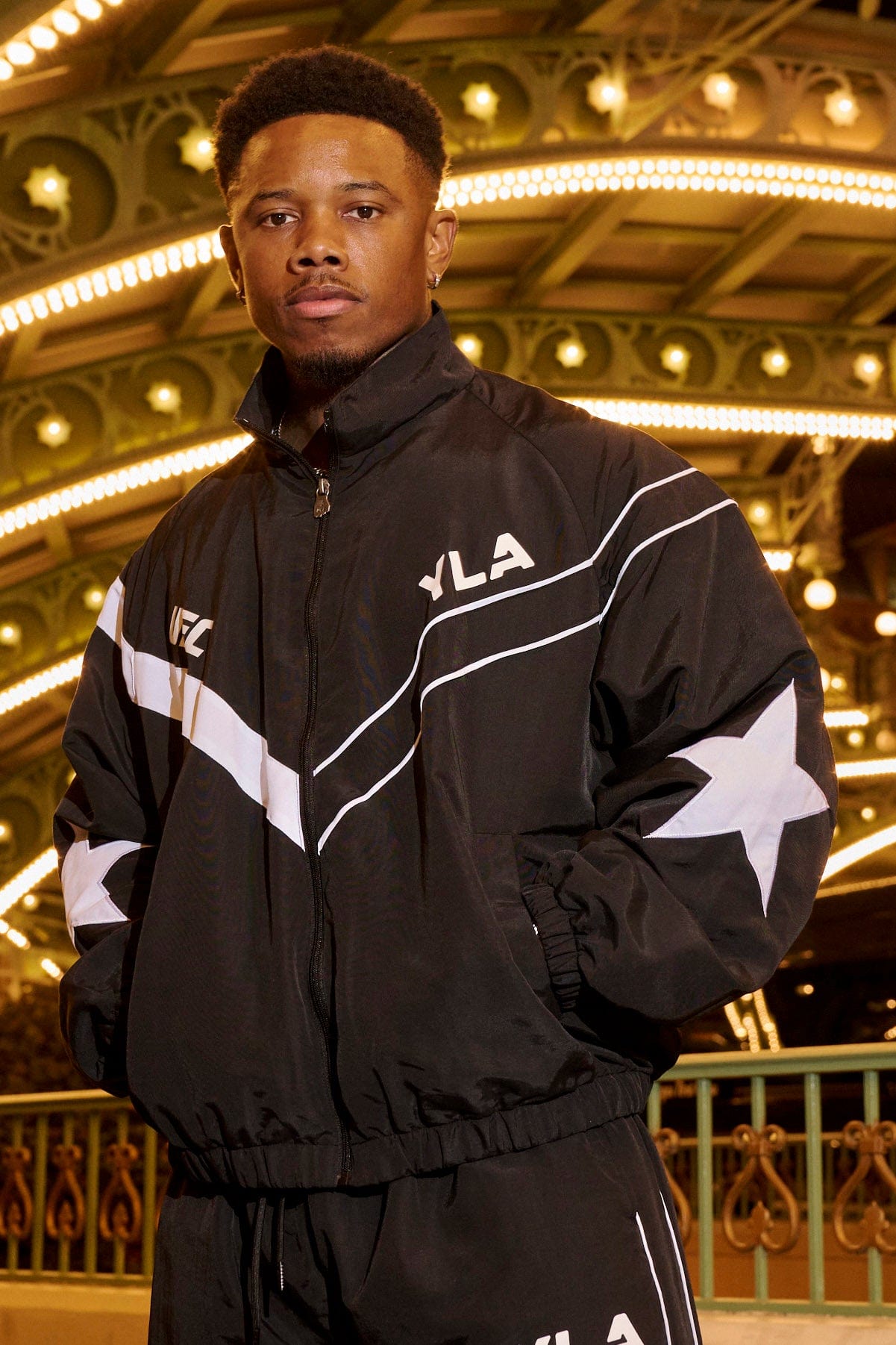 Model wearing the UFC™ tracksuit jacket, perfect for casual outings or gym sessions.