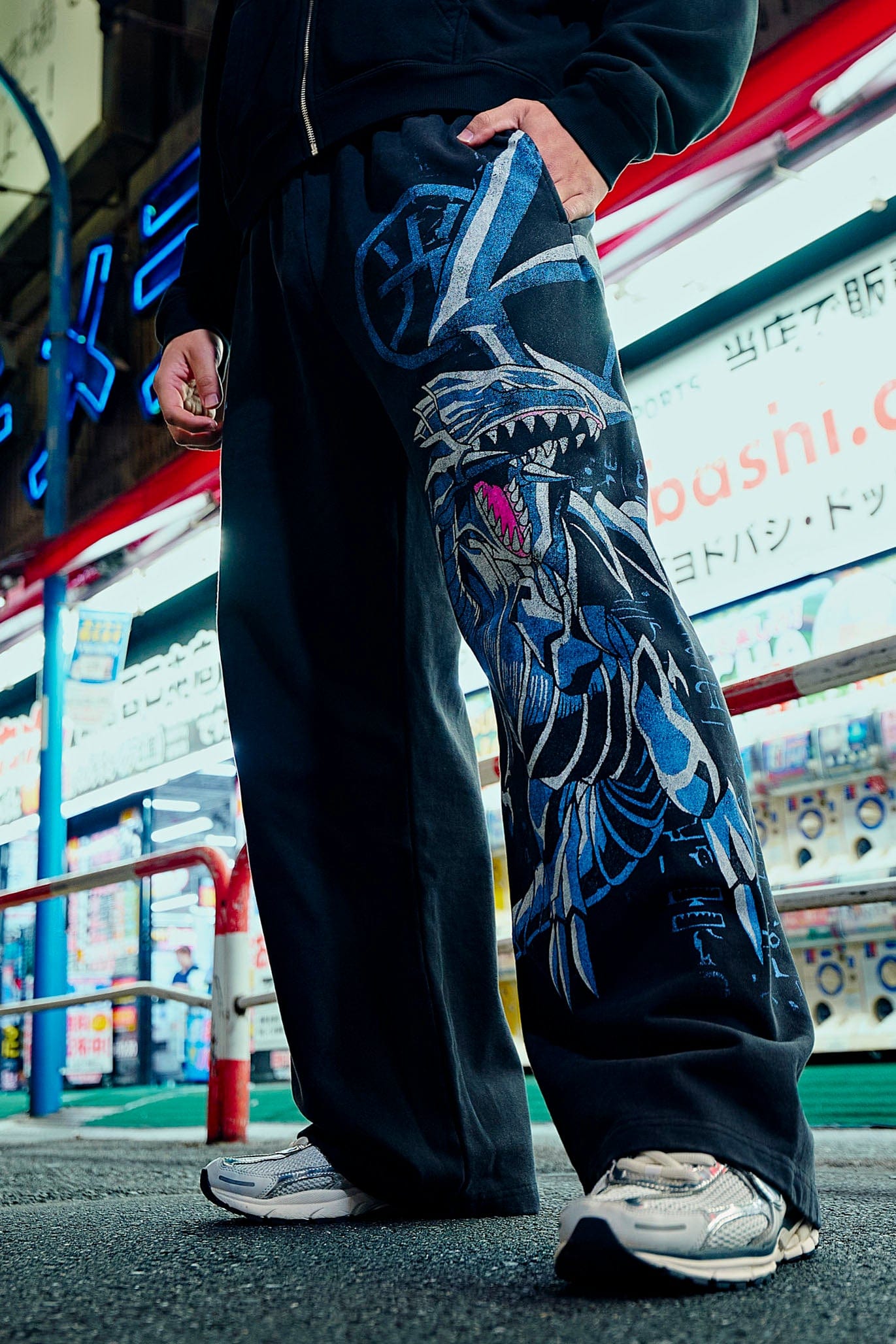 Front view of baggy gray sweatpants with Yu-Gi-Oh! graphic print