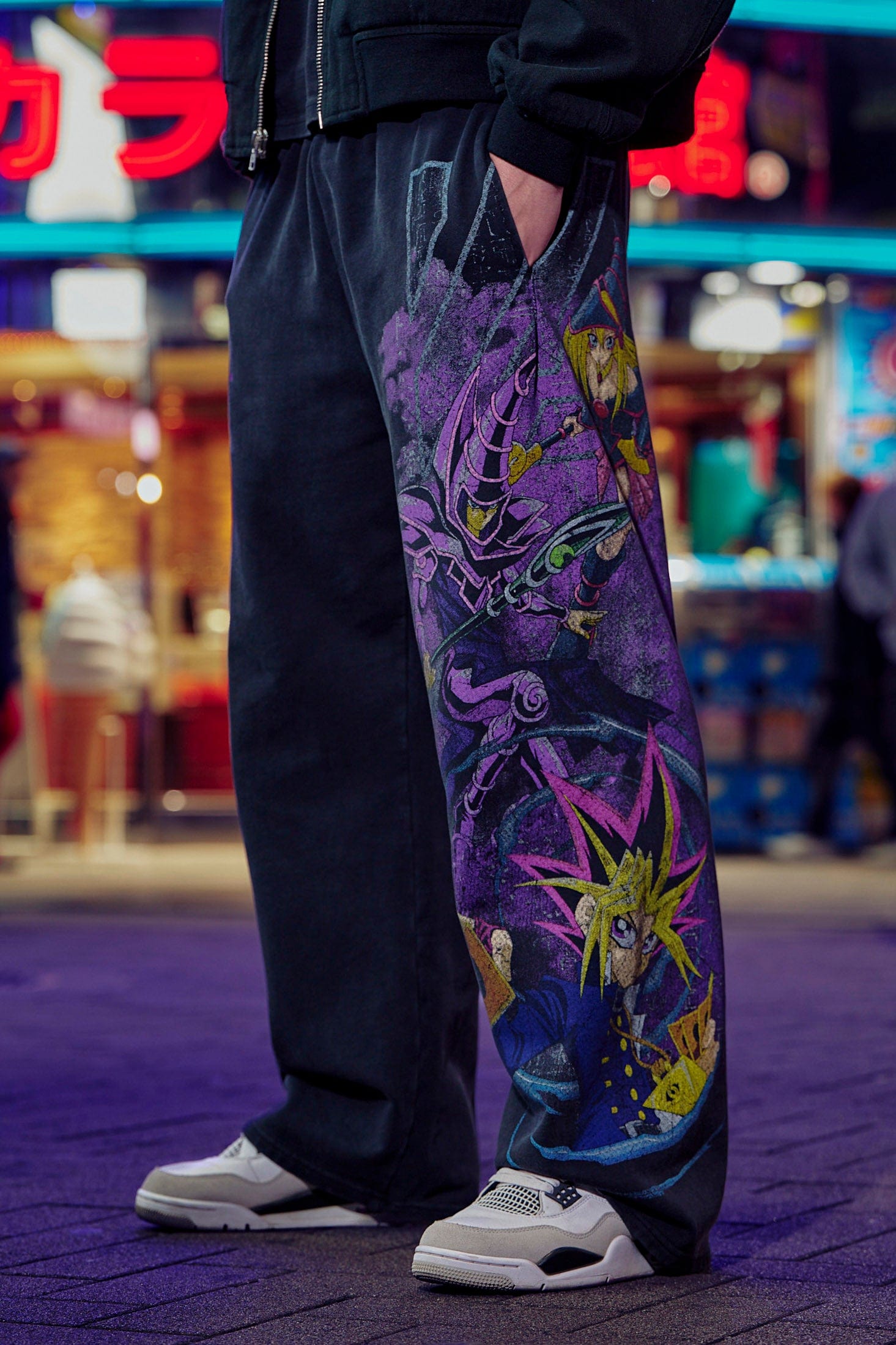 Front view of baggy gray sweatpants with Yu-Gi-Oh! graphic print