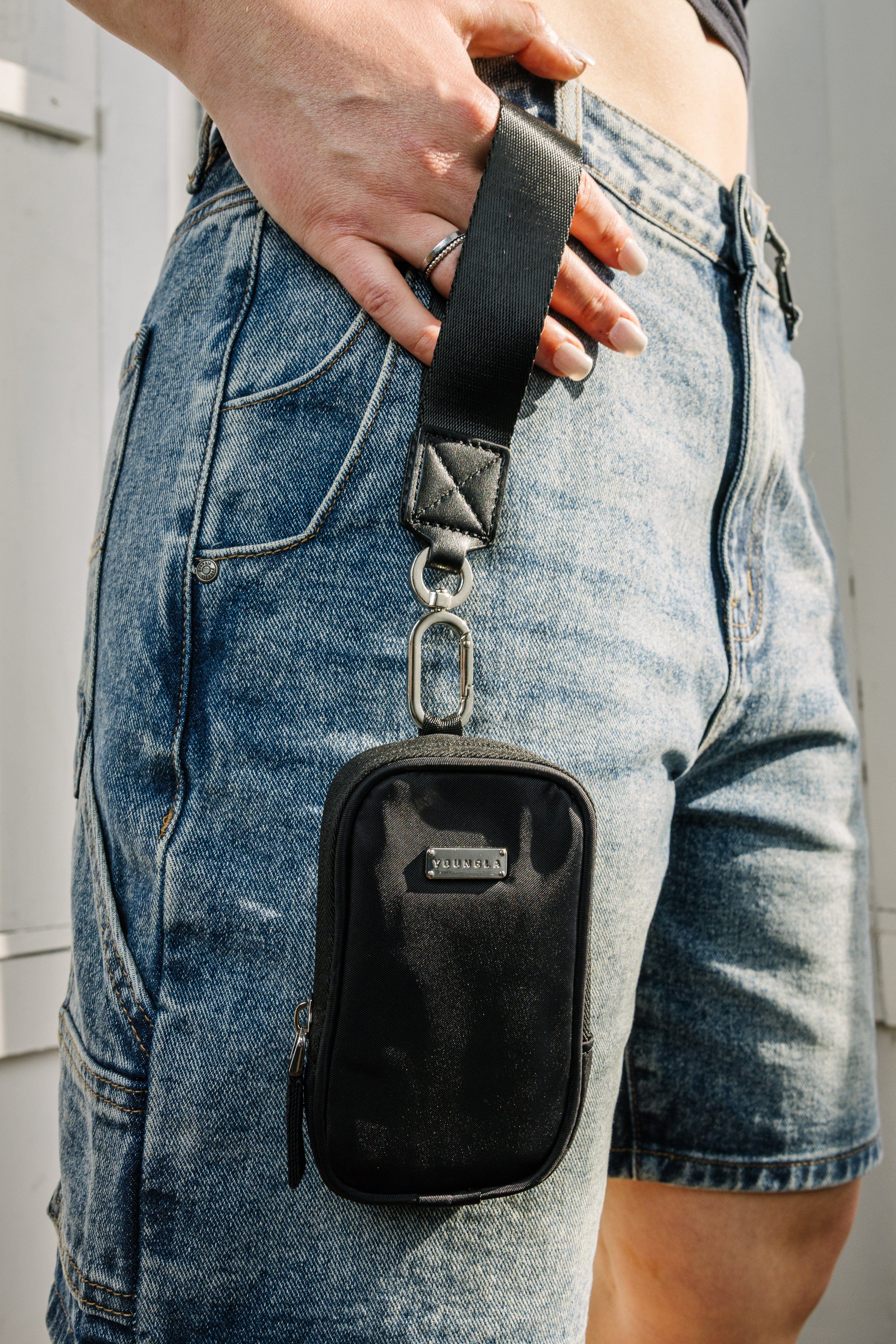 Stylish nylon mini pouch attached to a festival bag