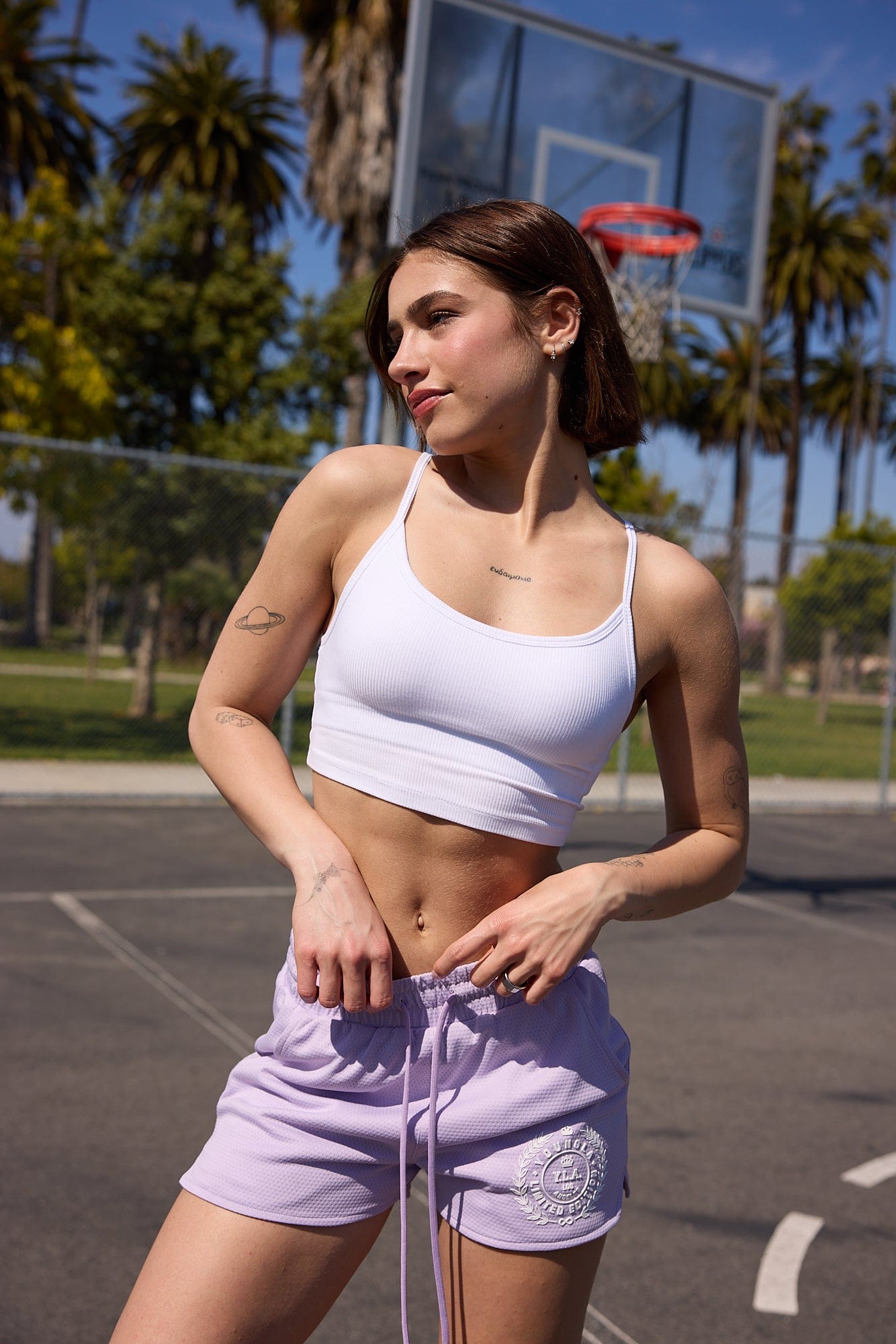 Front view of padded men's tank top with urban street background