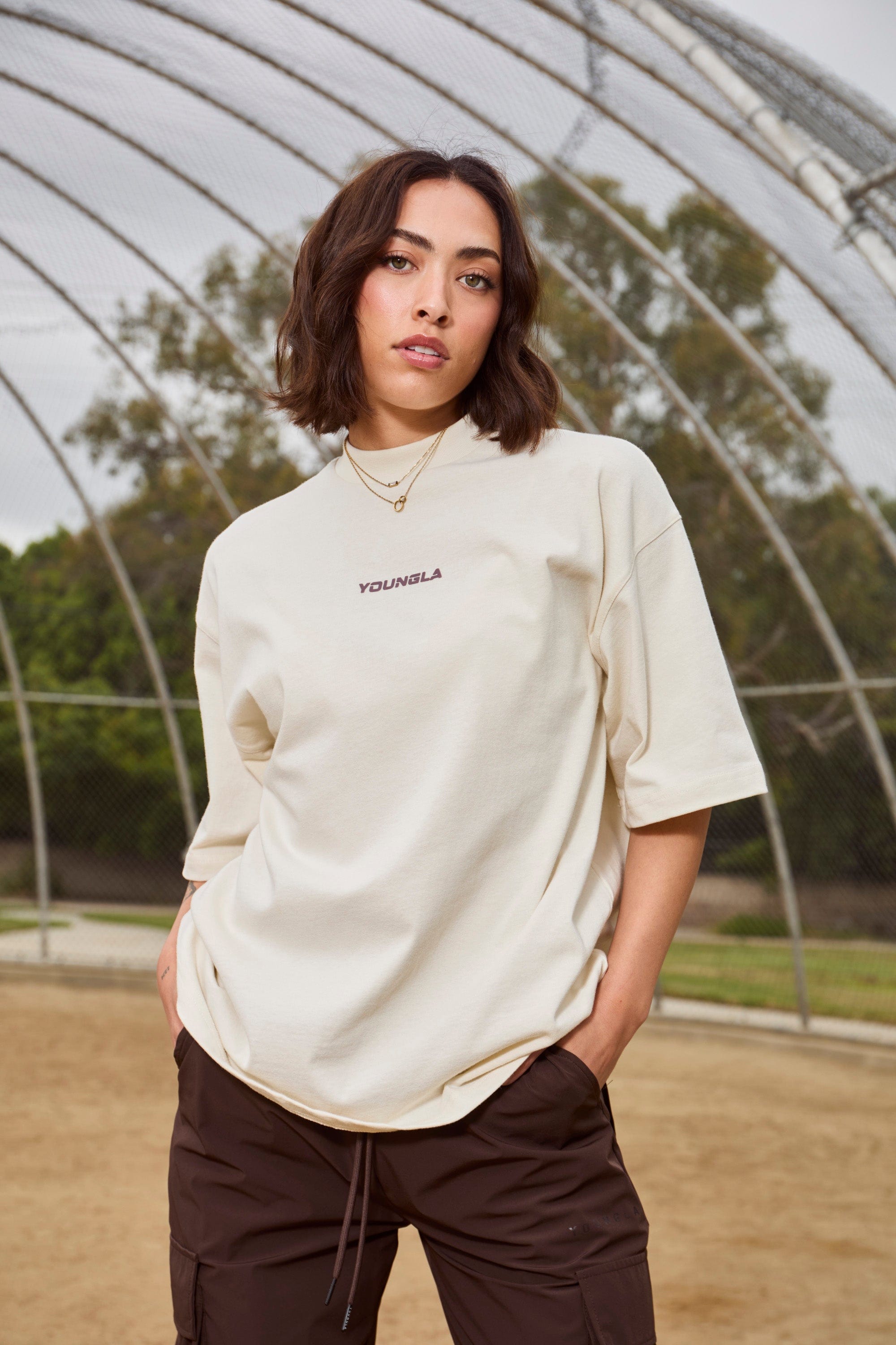 Front view of oversized digital graphic tee with bold print