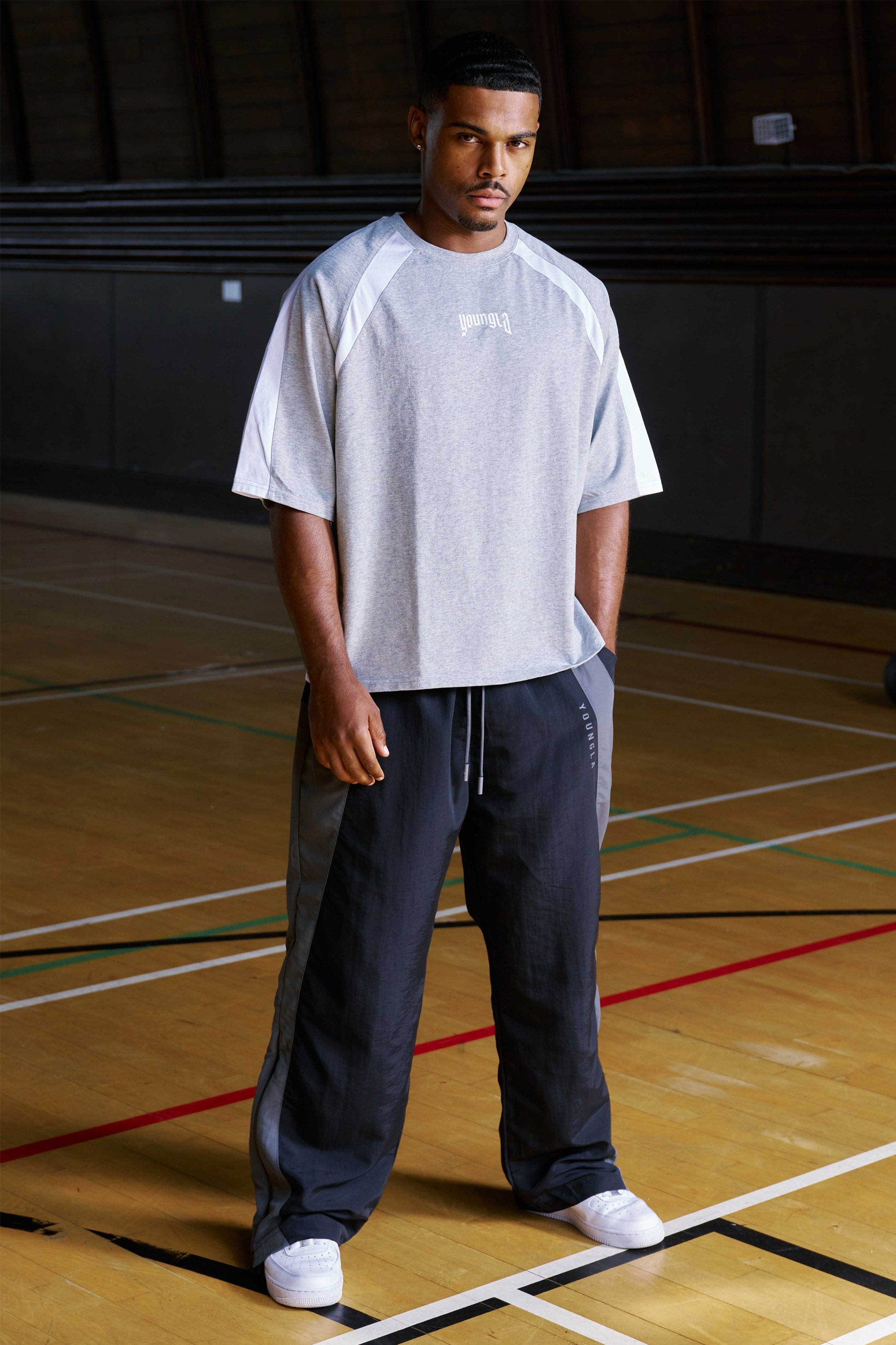 Close-up of zippered leg openings on track pants