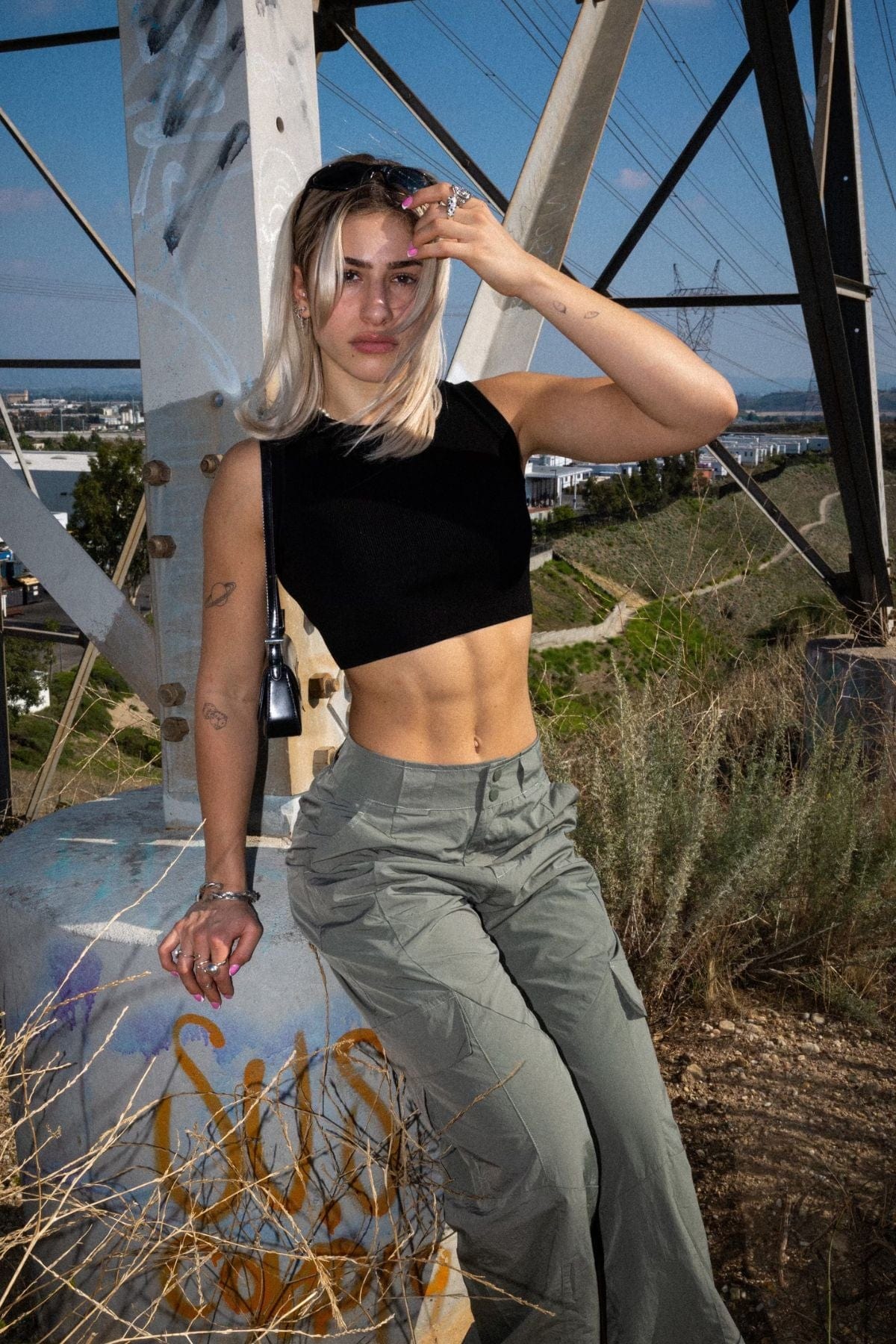 YoungLA black crop top worn with denim for an urban autumn outfit