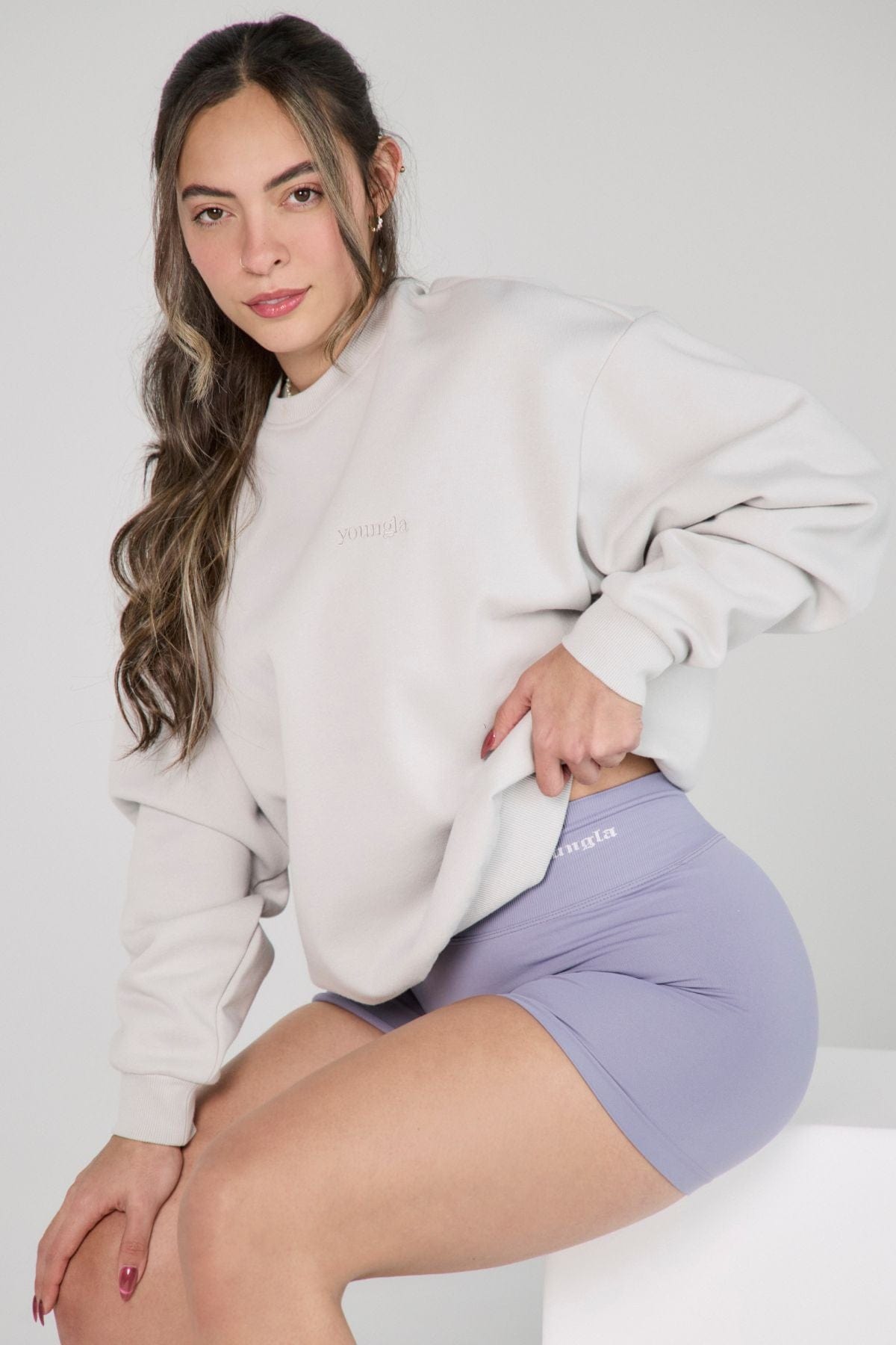 Close-up of marshmallow-textured fleece on oversized crewneck fleece in natural light
