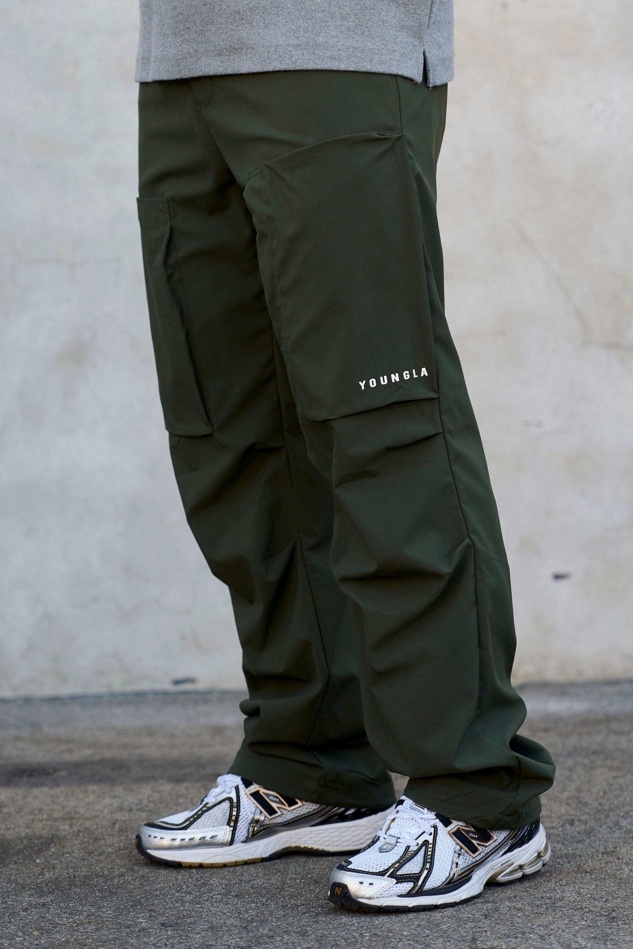 Woman wearing waterproof hiking pants on a muddy trail