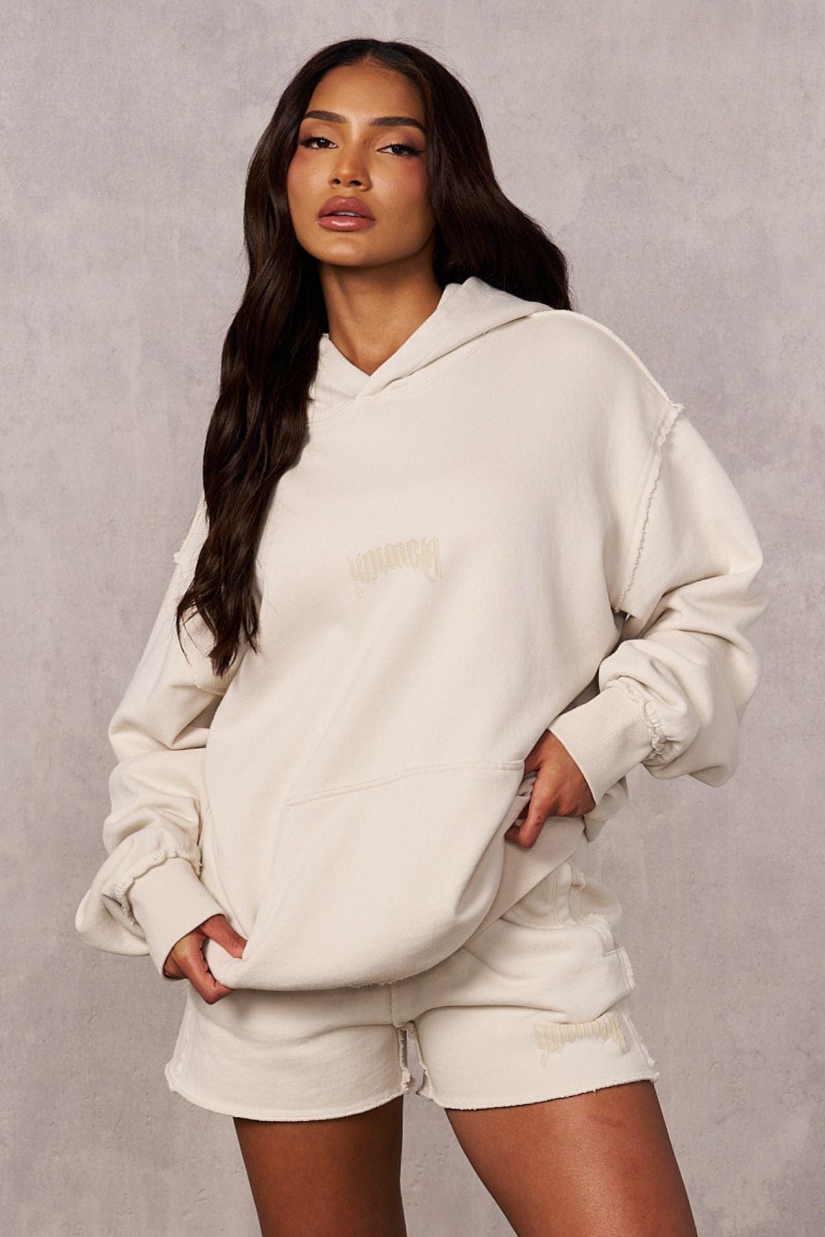 Rebel Oversized Hoodie front view with earthy tone and logo detail