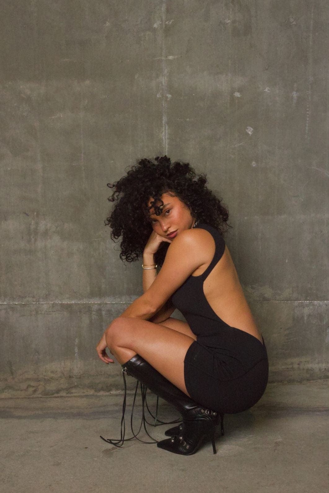 Side angle highlighting the 1930s-inspired silhouette of the romper
