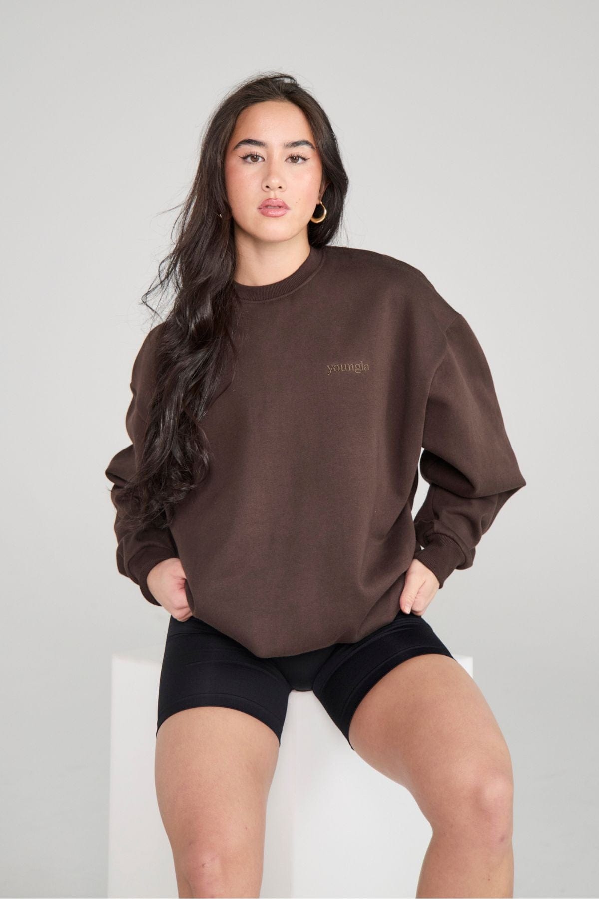 Close-up of marshmallow-textured fleece on oversized crewneck fleece in natural light