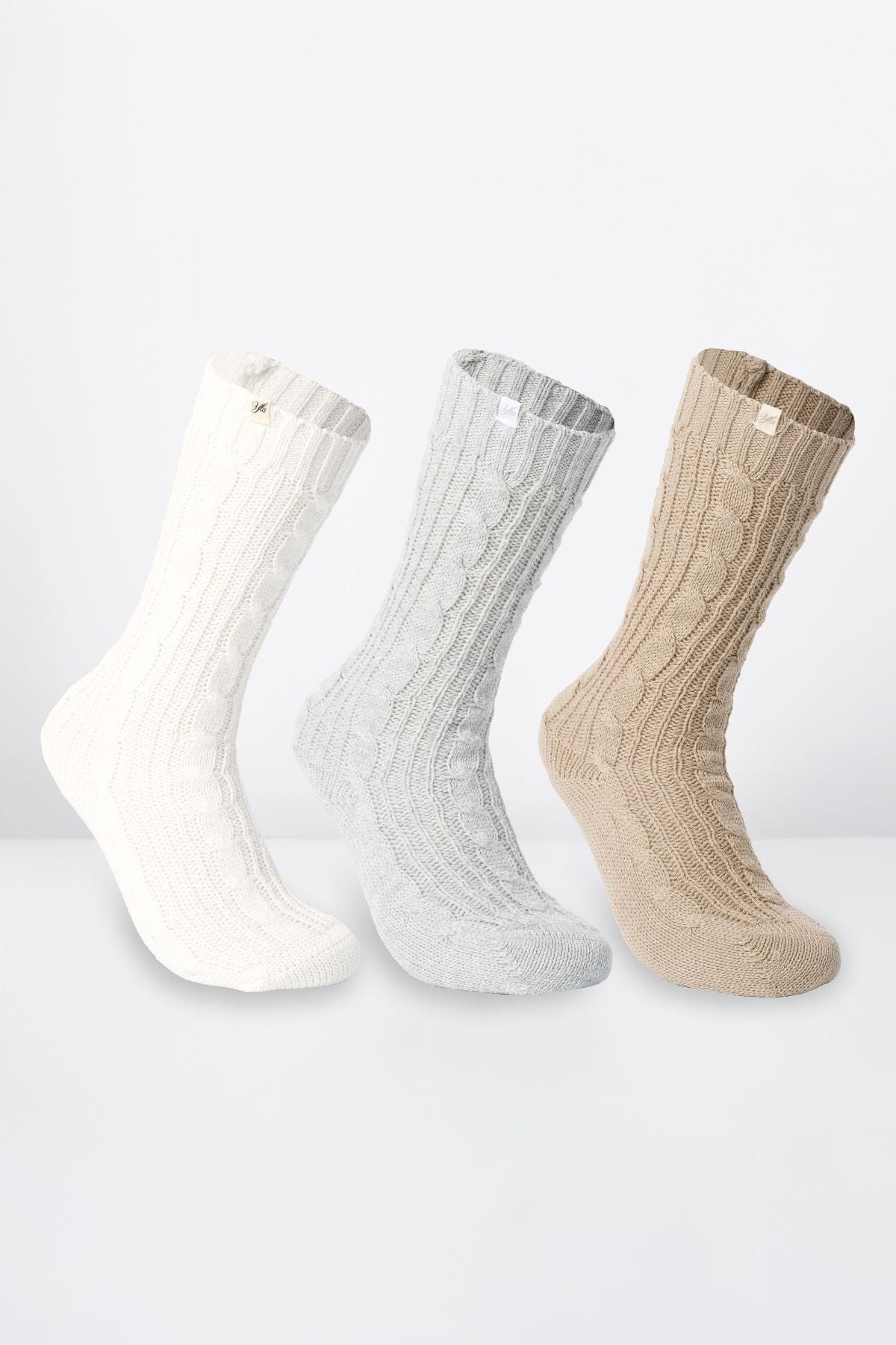Cozy Earth Toastie Sweater Socks displayed on a soft blanket, ideal for chilly days.