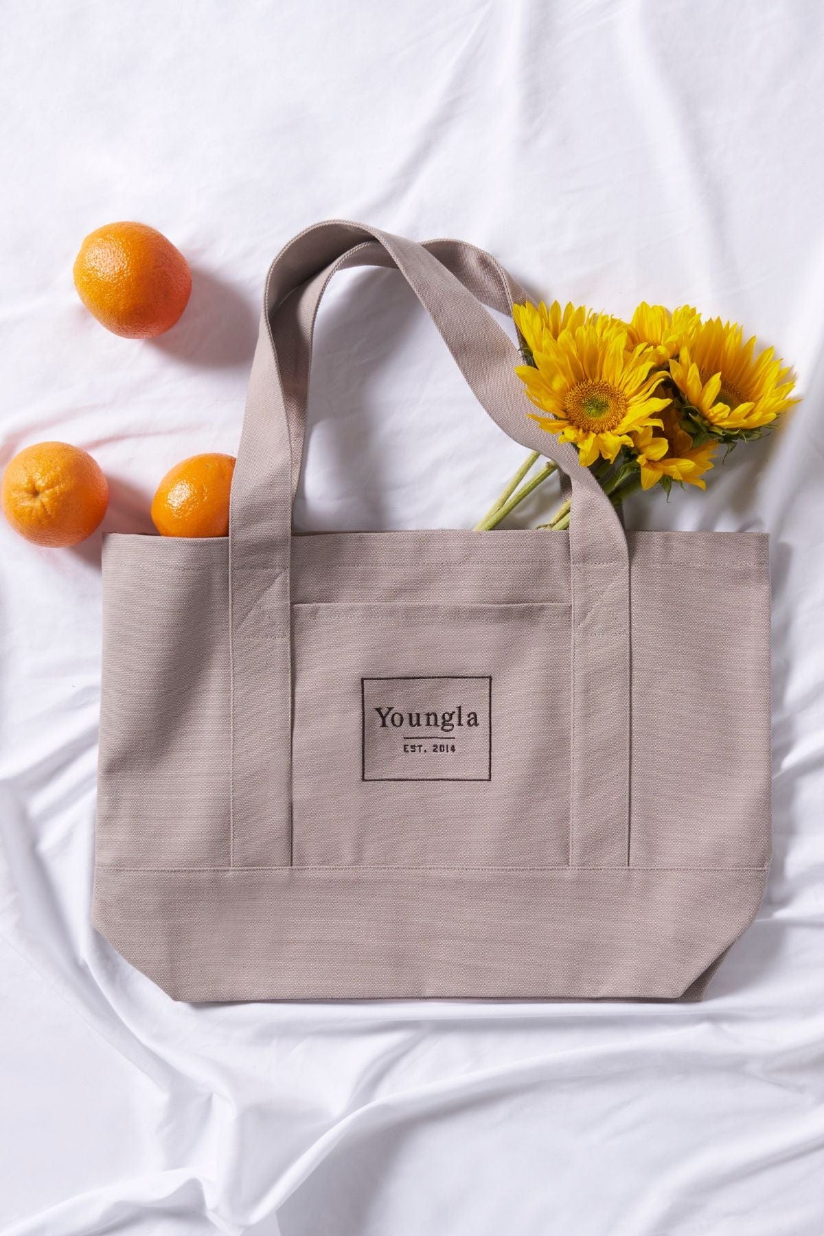 EcoHarvest canvas tote filled with groceries during a market visit