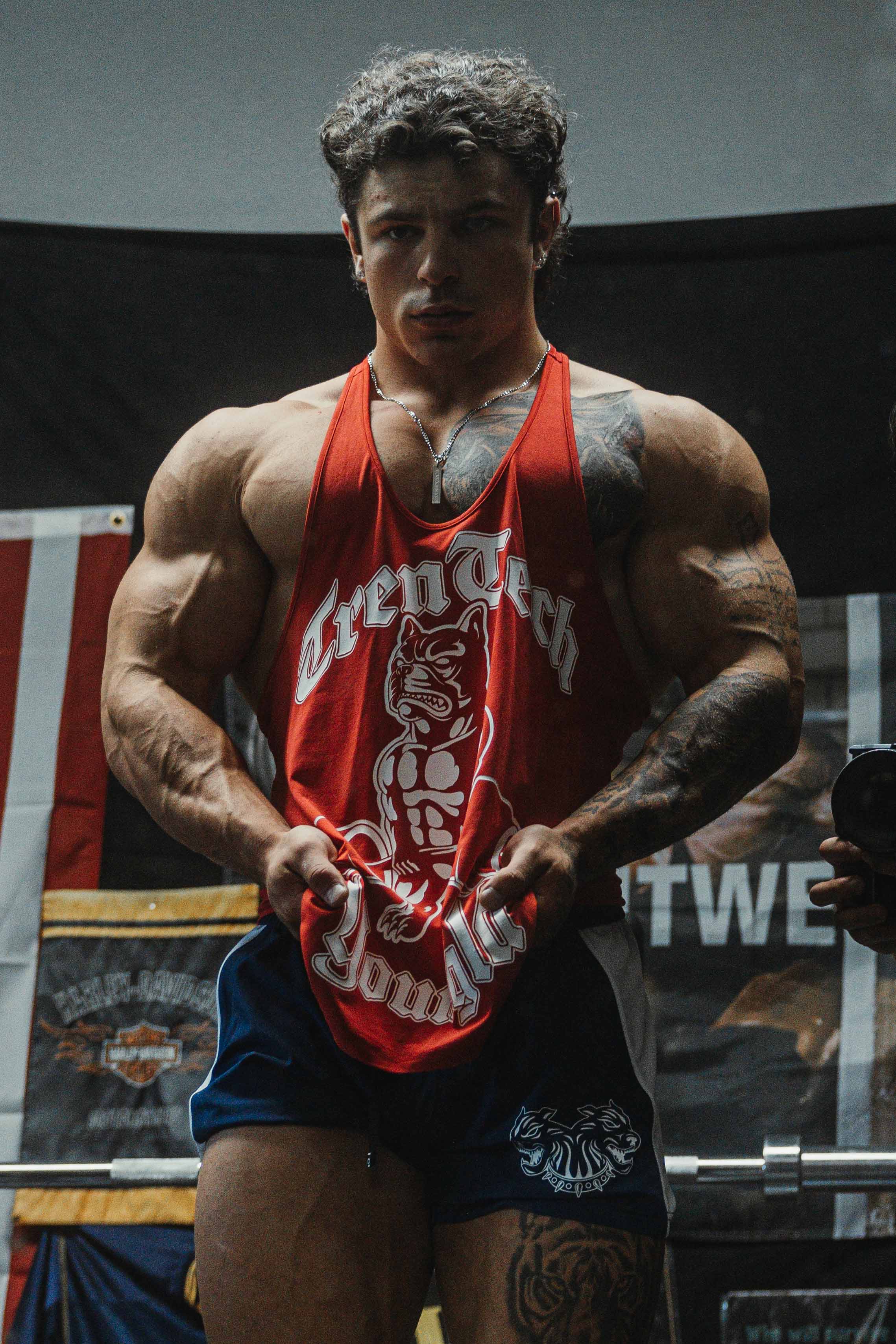 Tren Twins stringer tank top showcasing muscle definition