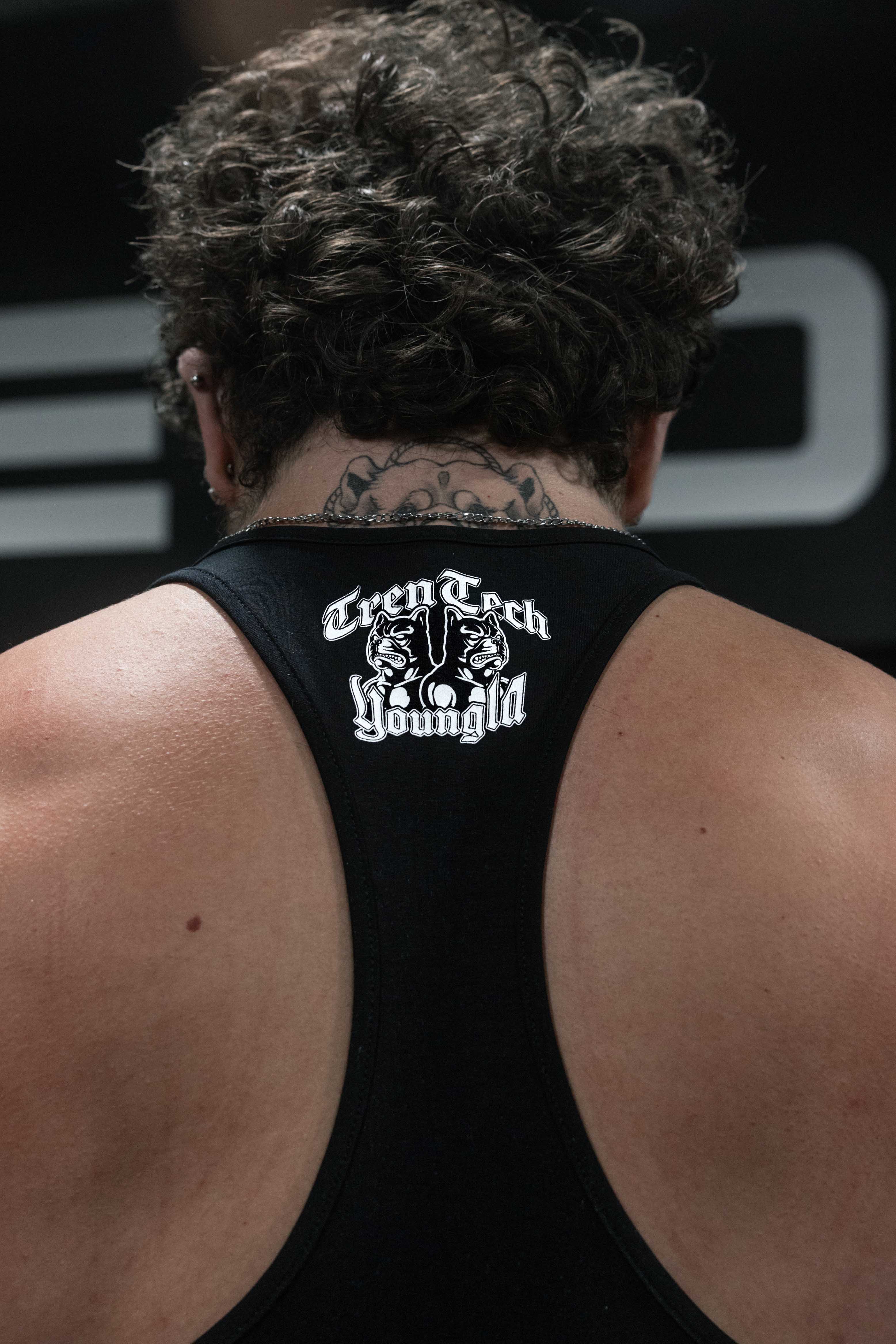 Back angle of the gym tank top with stretchable fabric detail