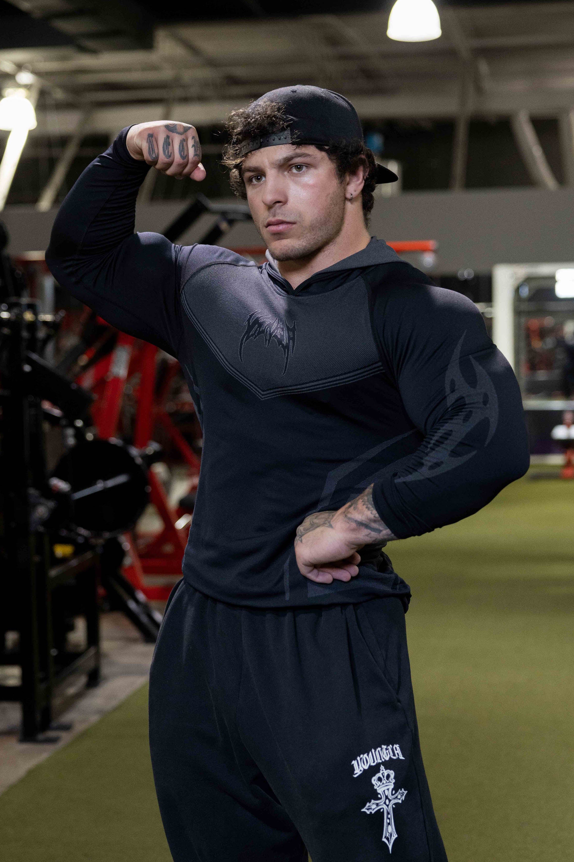 Model wearing the lightweight performance hoodie during a workout session.