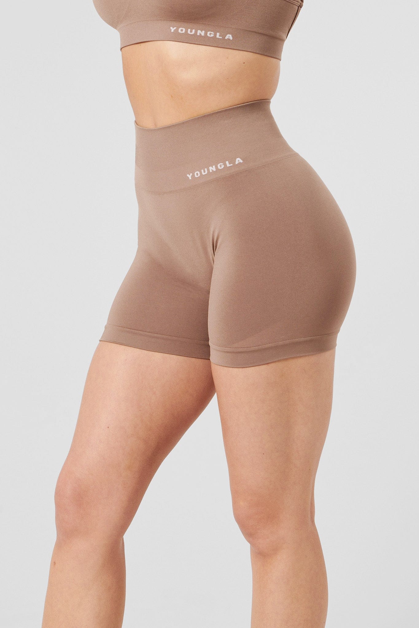 Model wearing mens compression shorts during a workout session.