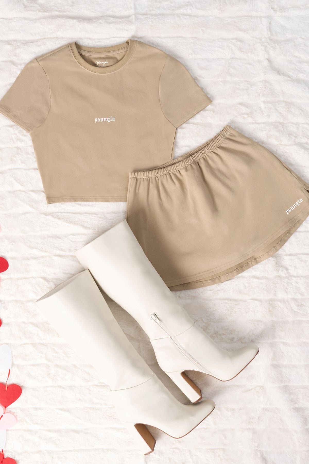 Close-up of the luxurious suede-touch fabric of the cotton midi skirt.