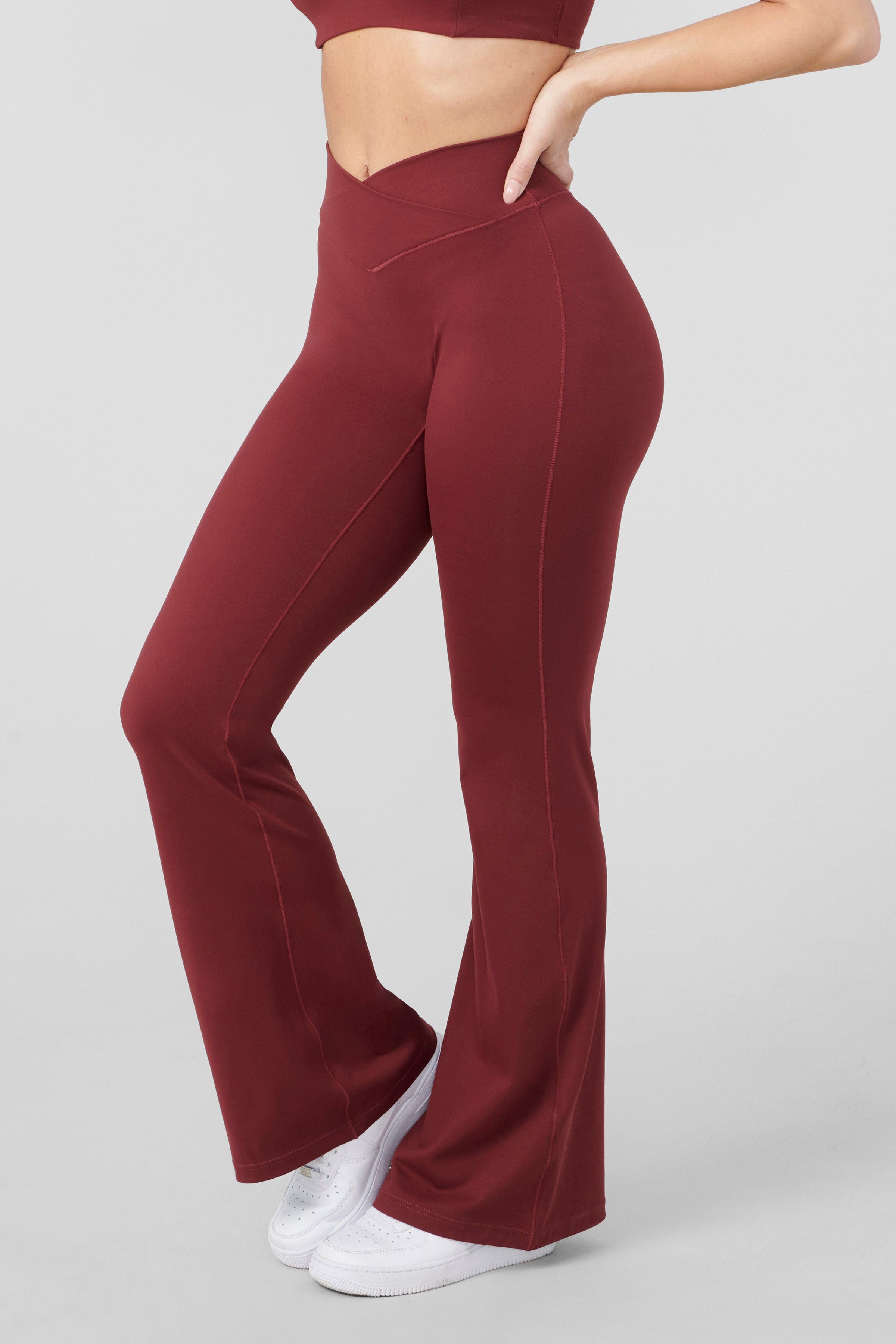 Side view of the Vital Flare Leggings, highlighting the crossover waist design.
