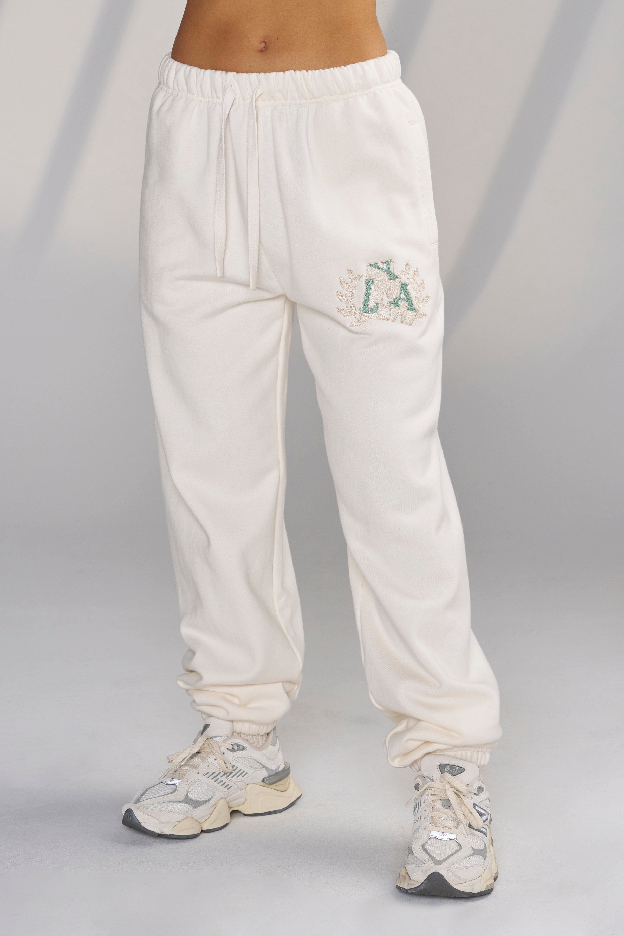 Side view of Teddy fleece joggers highlighting comfortable fit and embroidered logo