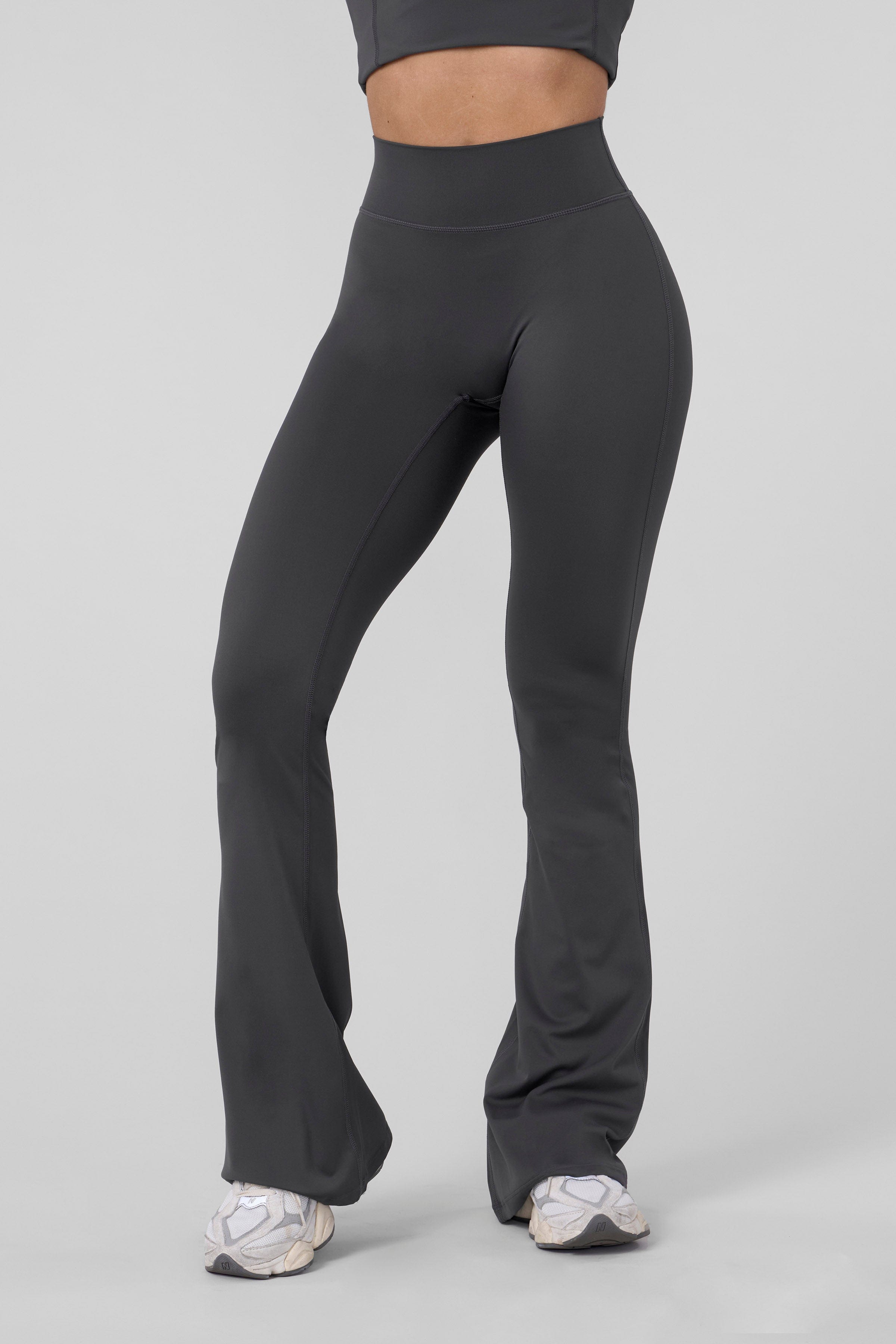 Back view showing curve-enhancing seam of flare leggings