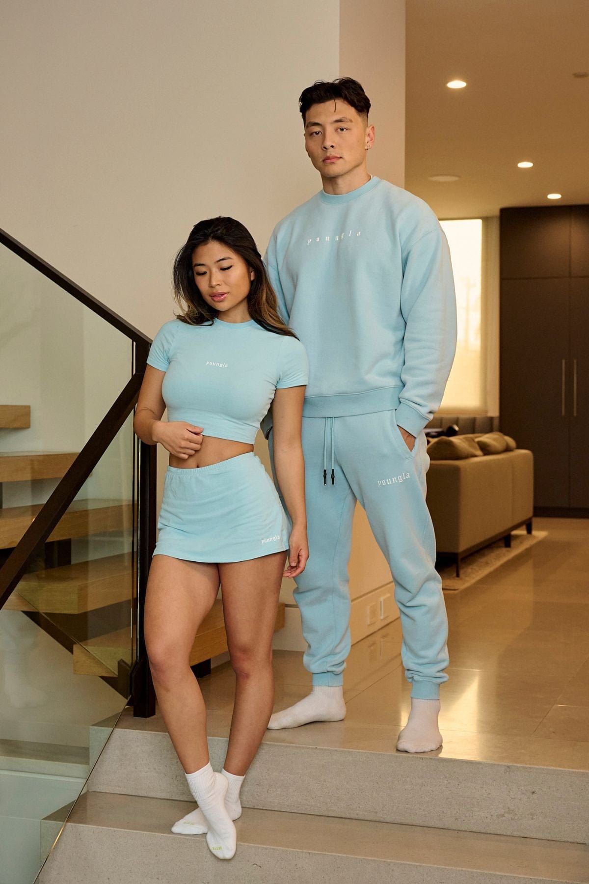Model wearing the baby tee with stylish shorts for a casual look.