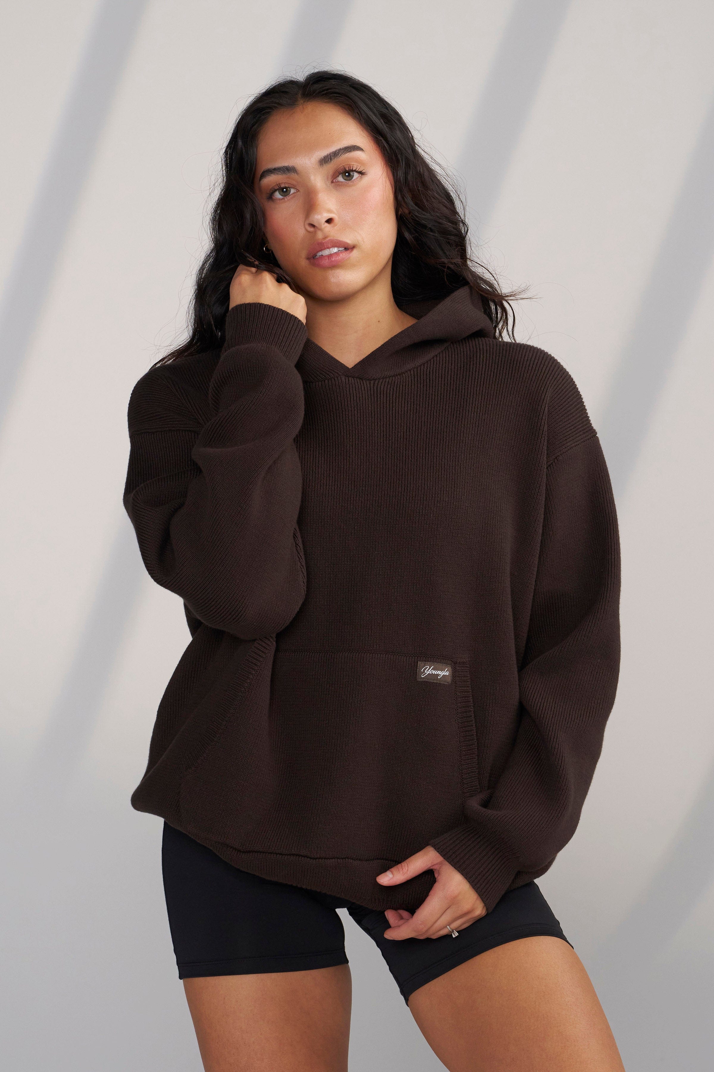 Close-up of YoungLA logo on the womens sweater hoodie.