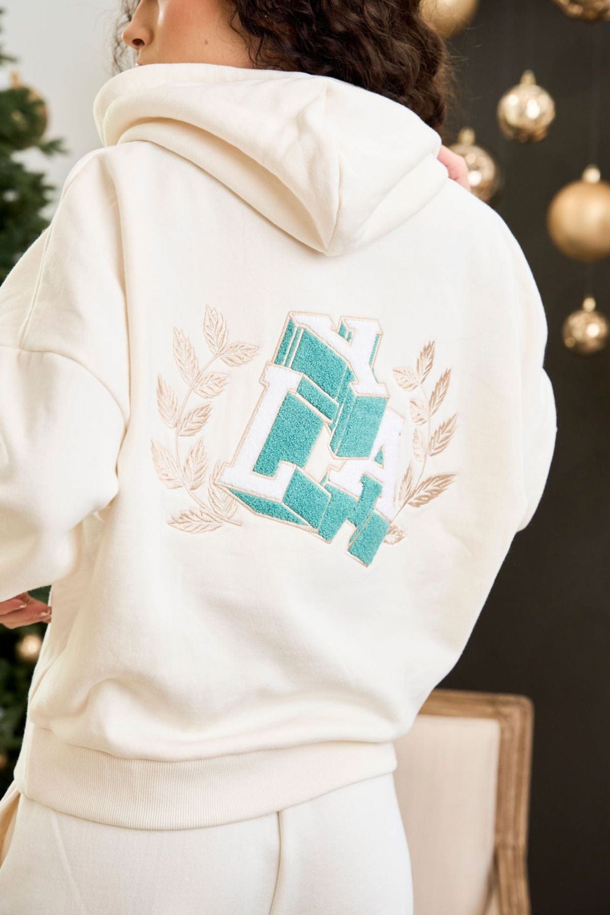 Model wearing the Cozy Chic Teddy Hoodie, styled for a casual outing.