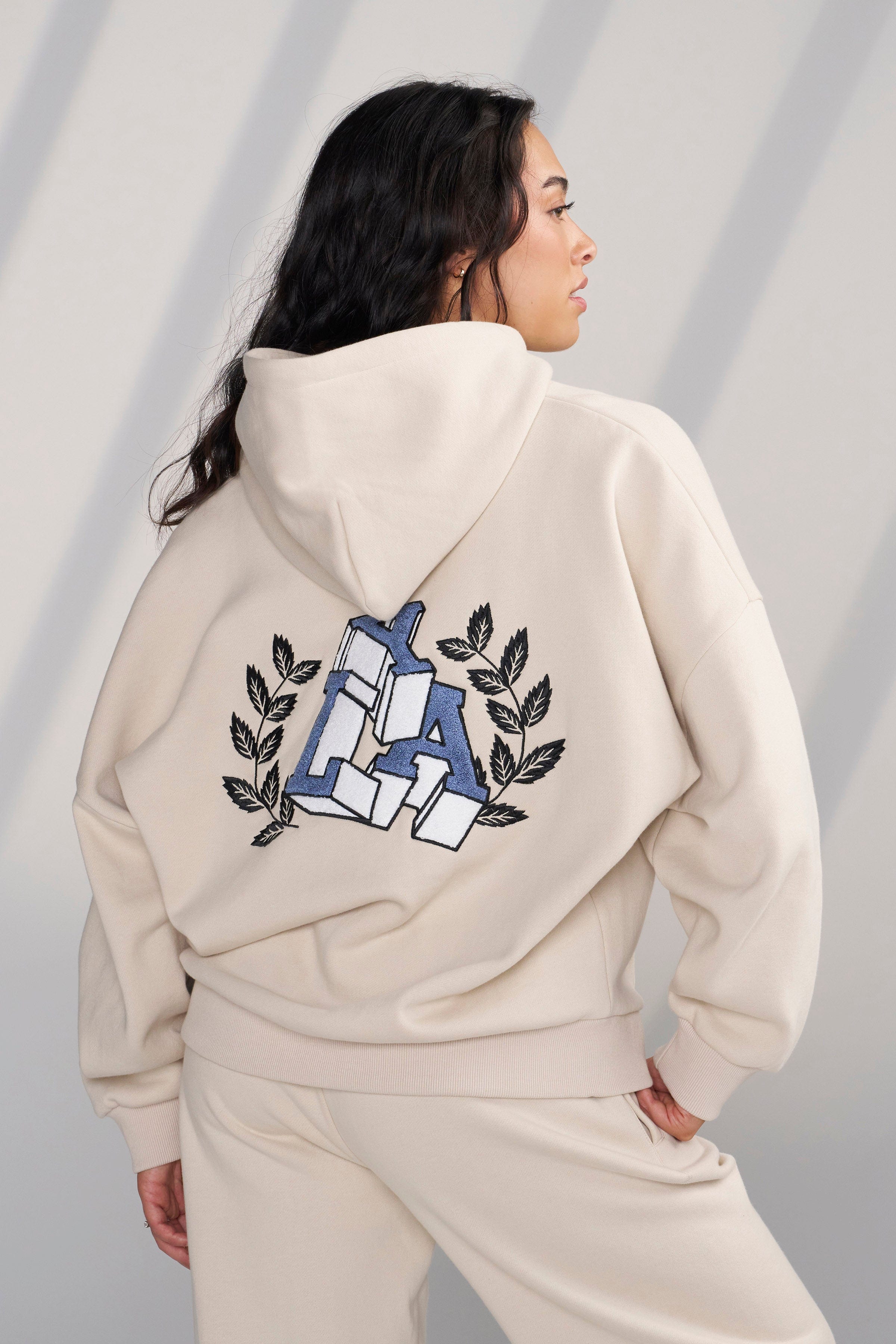 Model wearing the Cozy Chic Teddy Hoodie, styled for a casual outing.