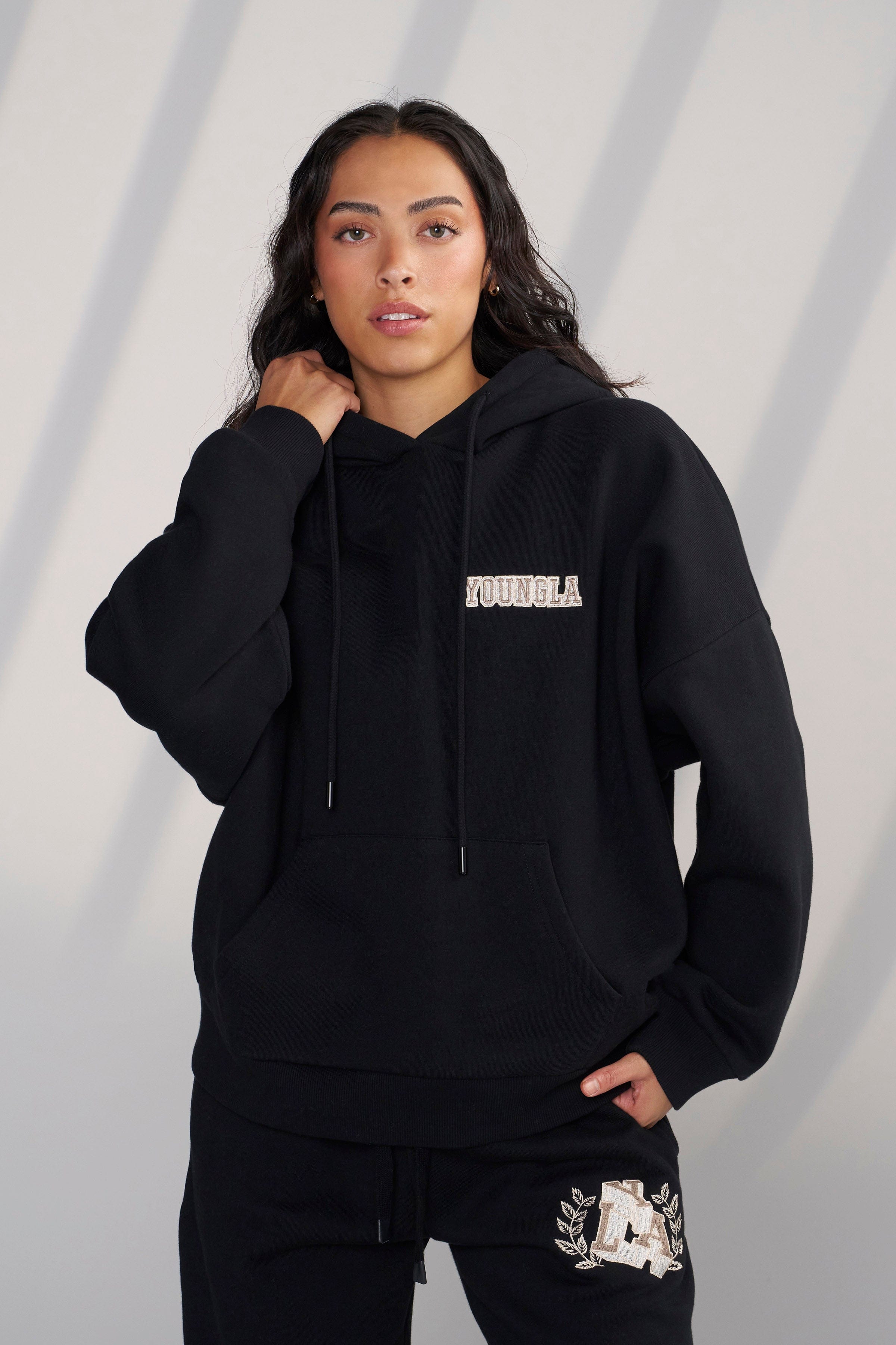Model wearing the Cozy Chic Teddy Hoodie, styled for a casual outing.