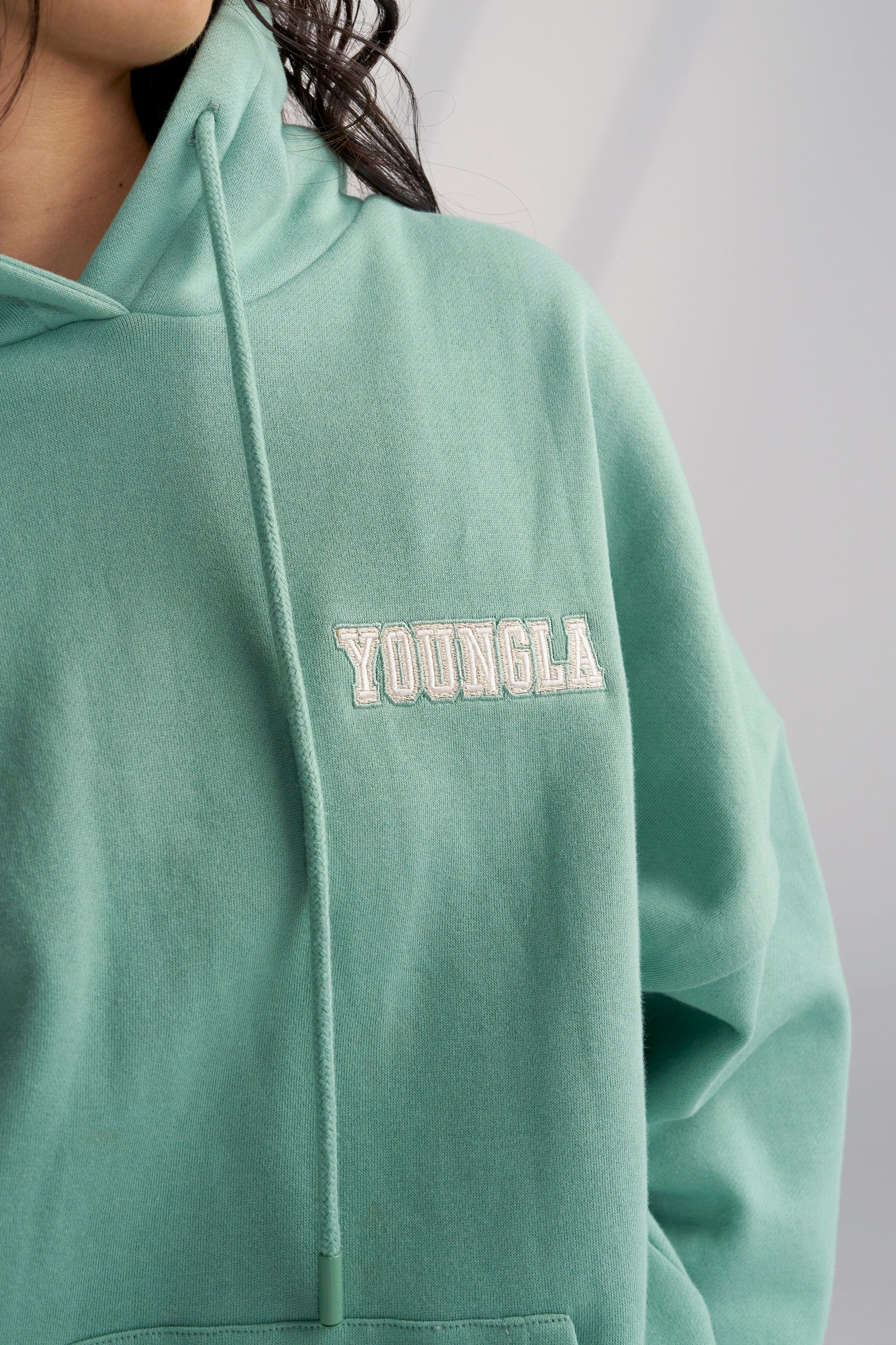 Model wearing the Cozy Chic Teddy Hoodie, styled for a casual outing.