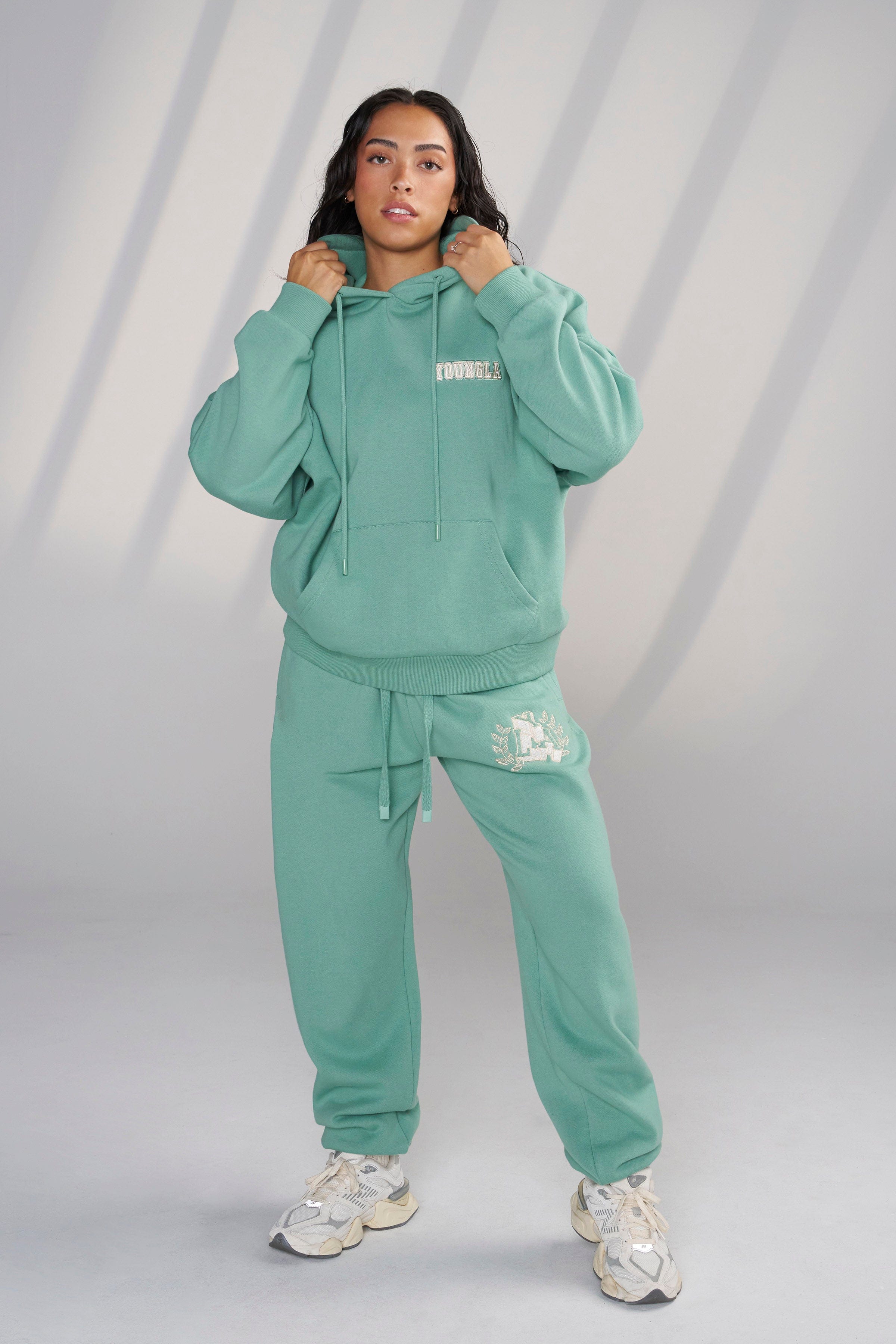 Model wearing the Cozy Chic Teddy Hoodie, styled for a casual outing.