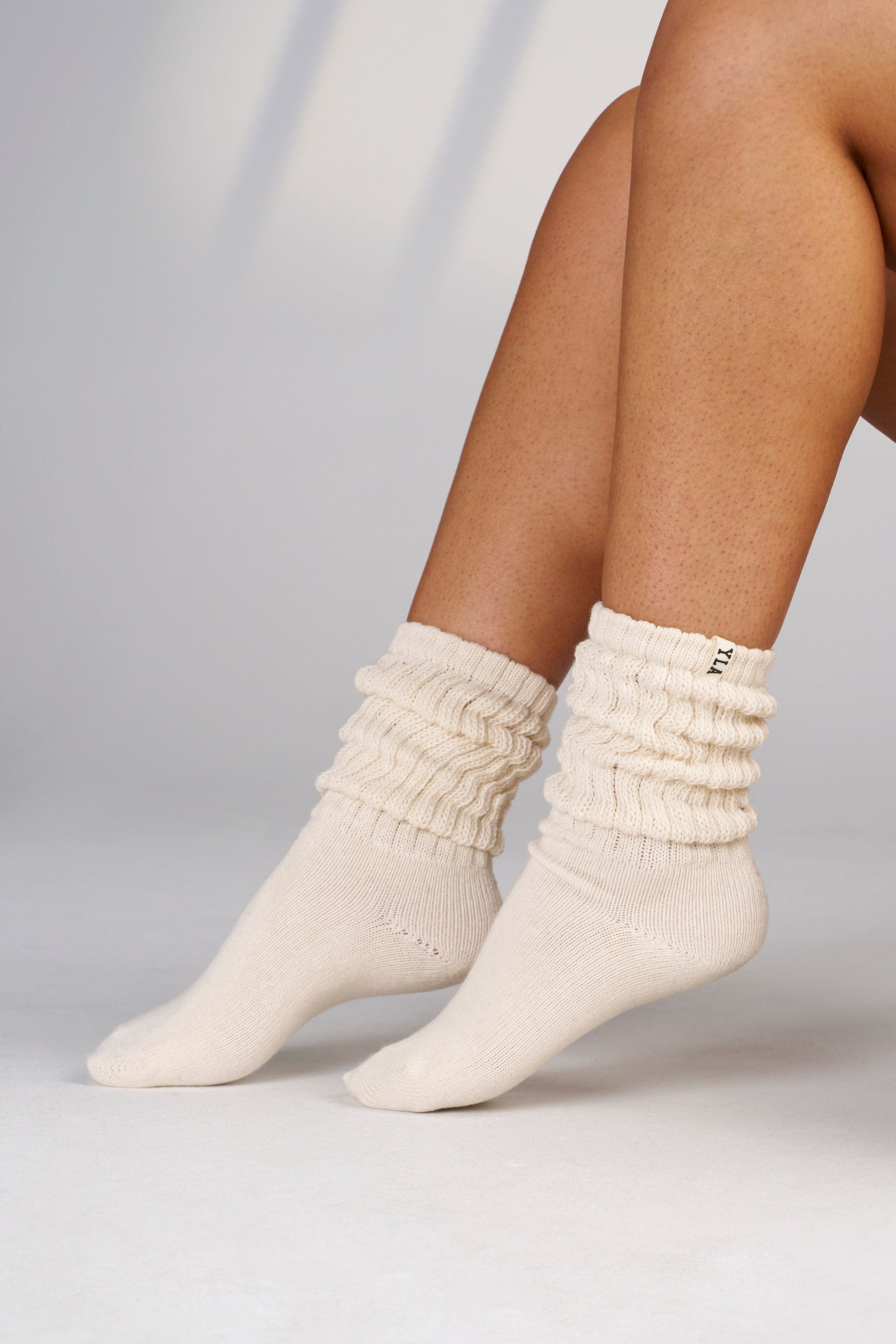 Women wearing scrunch socks with athletic shoes.