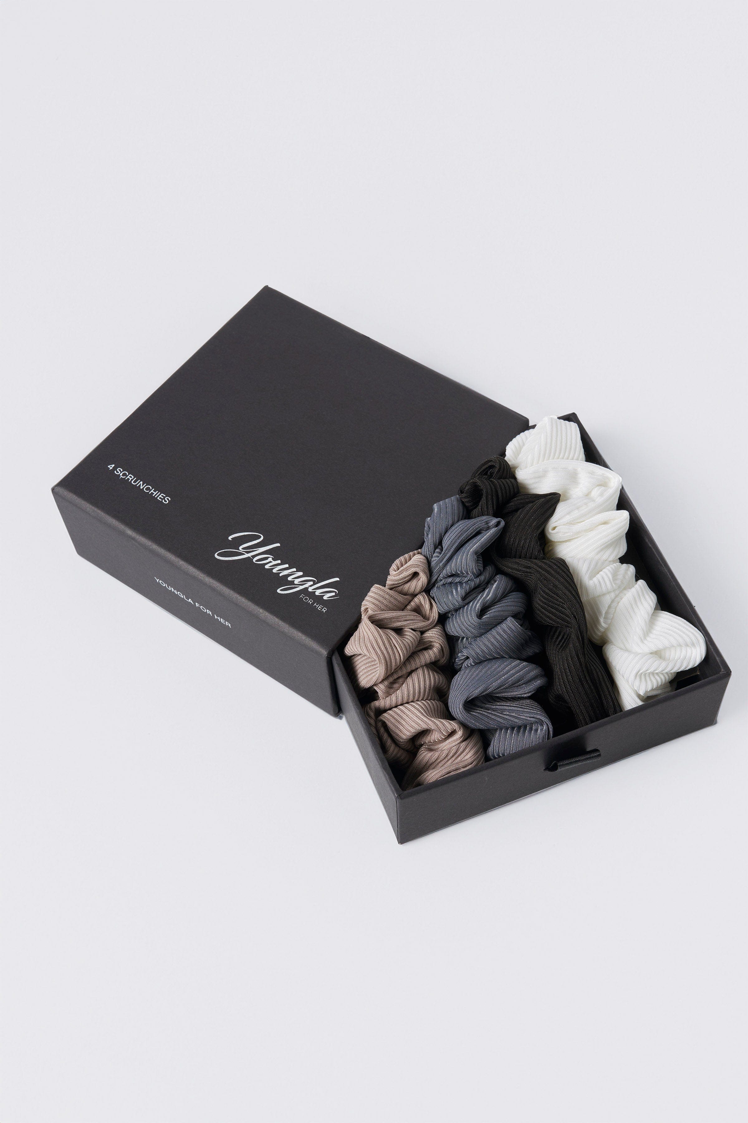Luxury silk scrunchies displayed in a stylish arrangement, showcasing their soft texture.