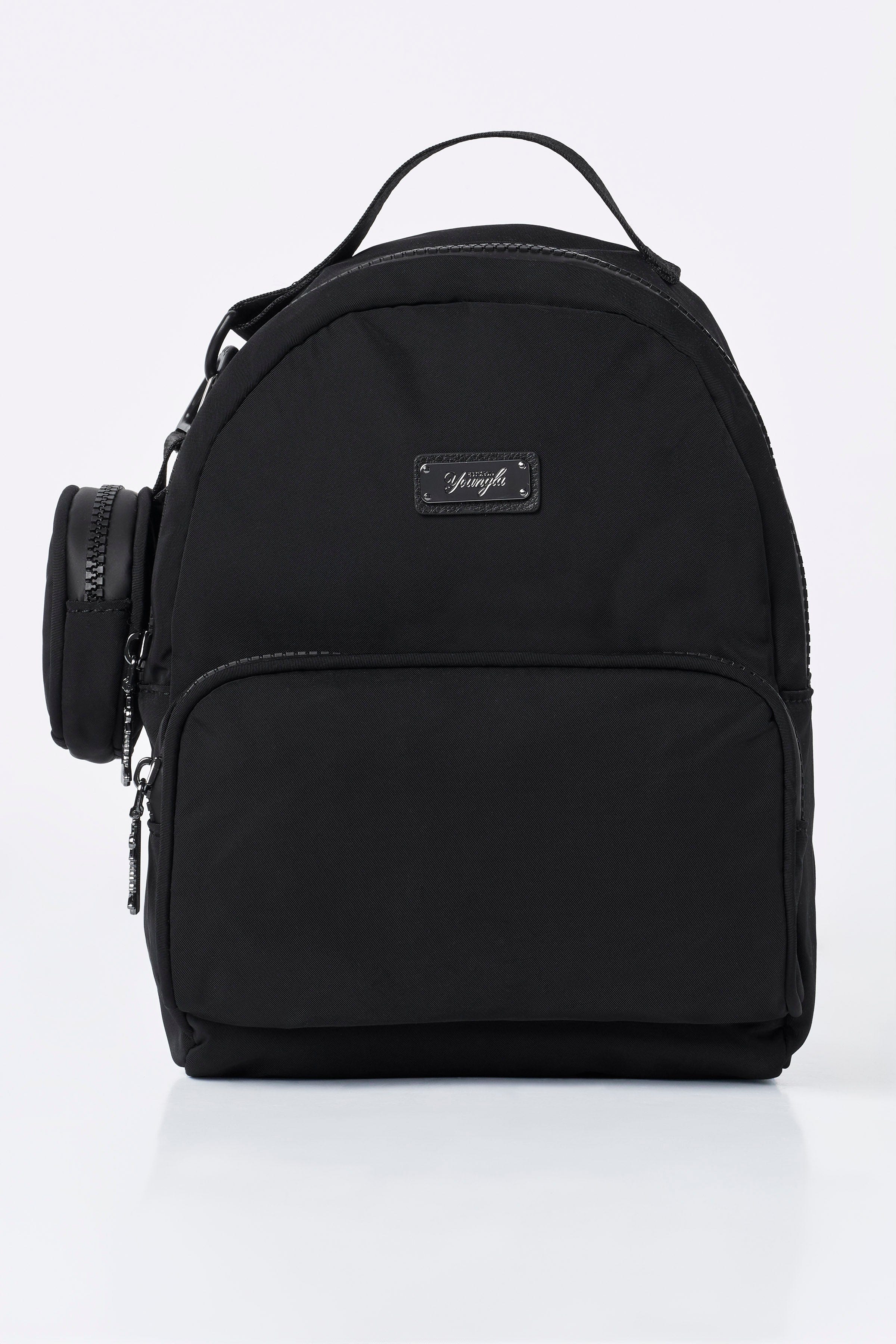 Fun sized backpack with open compartments holding travel essentials