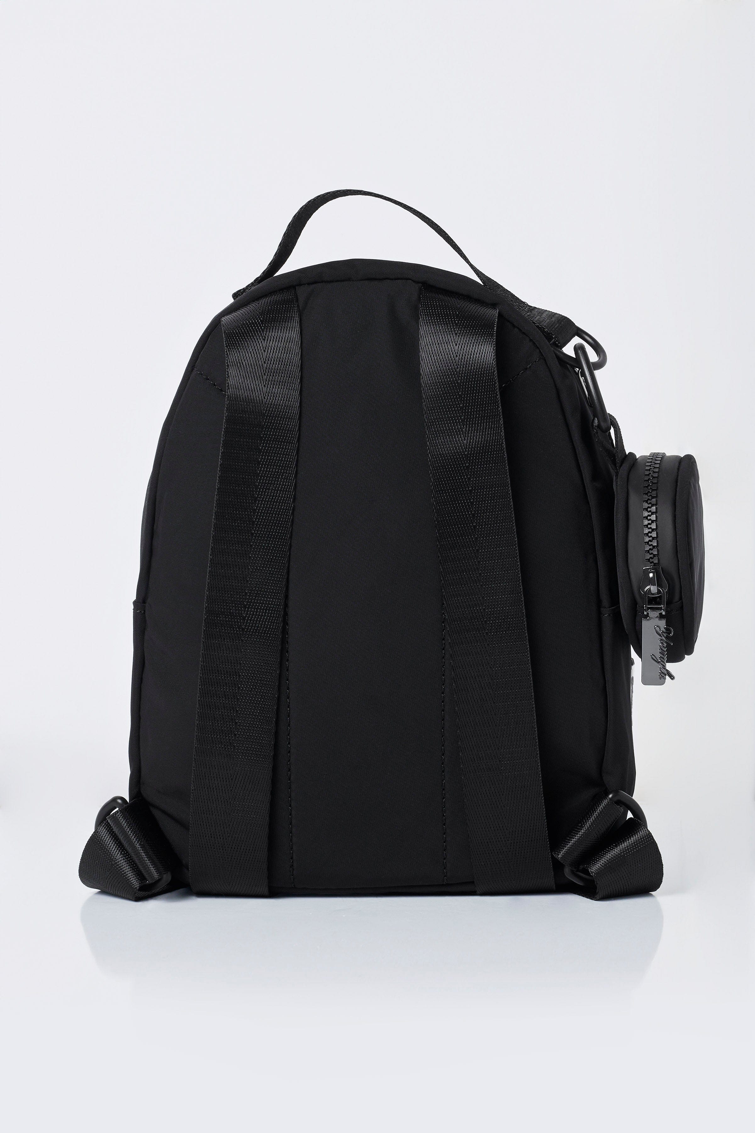Front view of compact backpack worn by traveler in Memphis street
