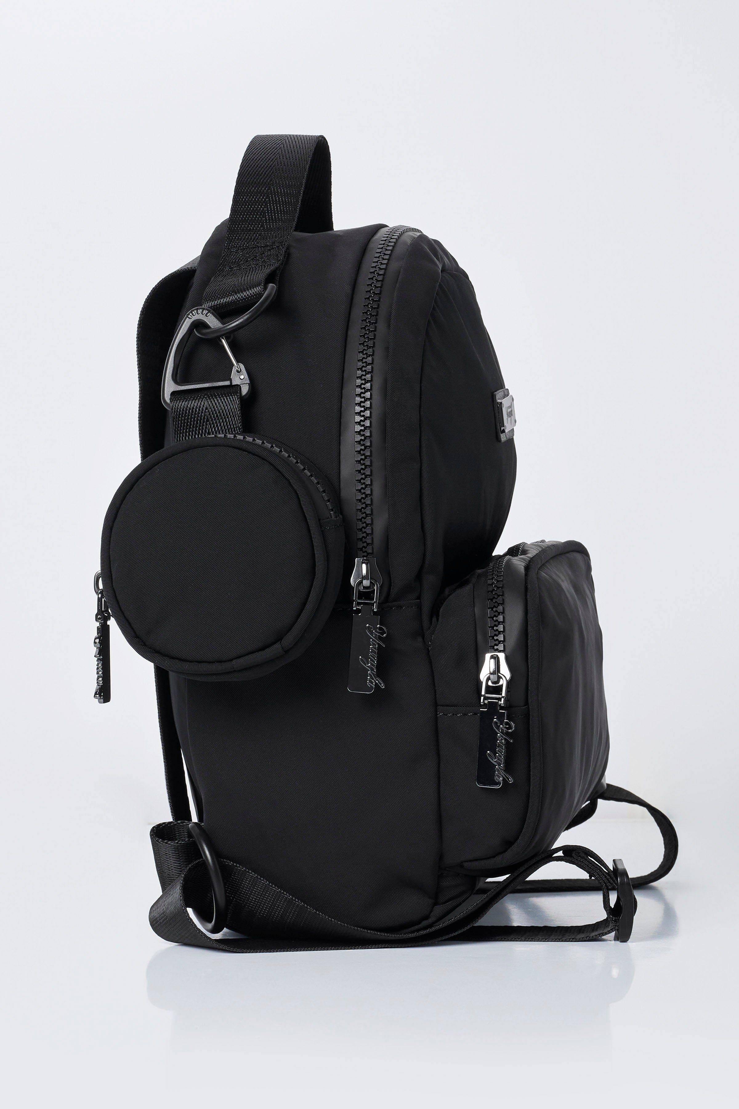 Fun sized backpack with open compartments holding travel essentials