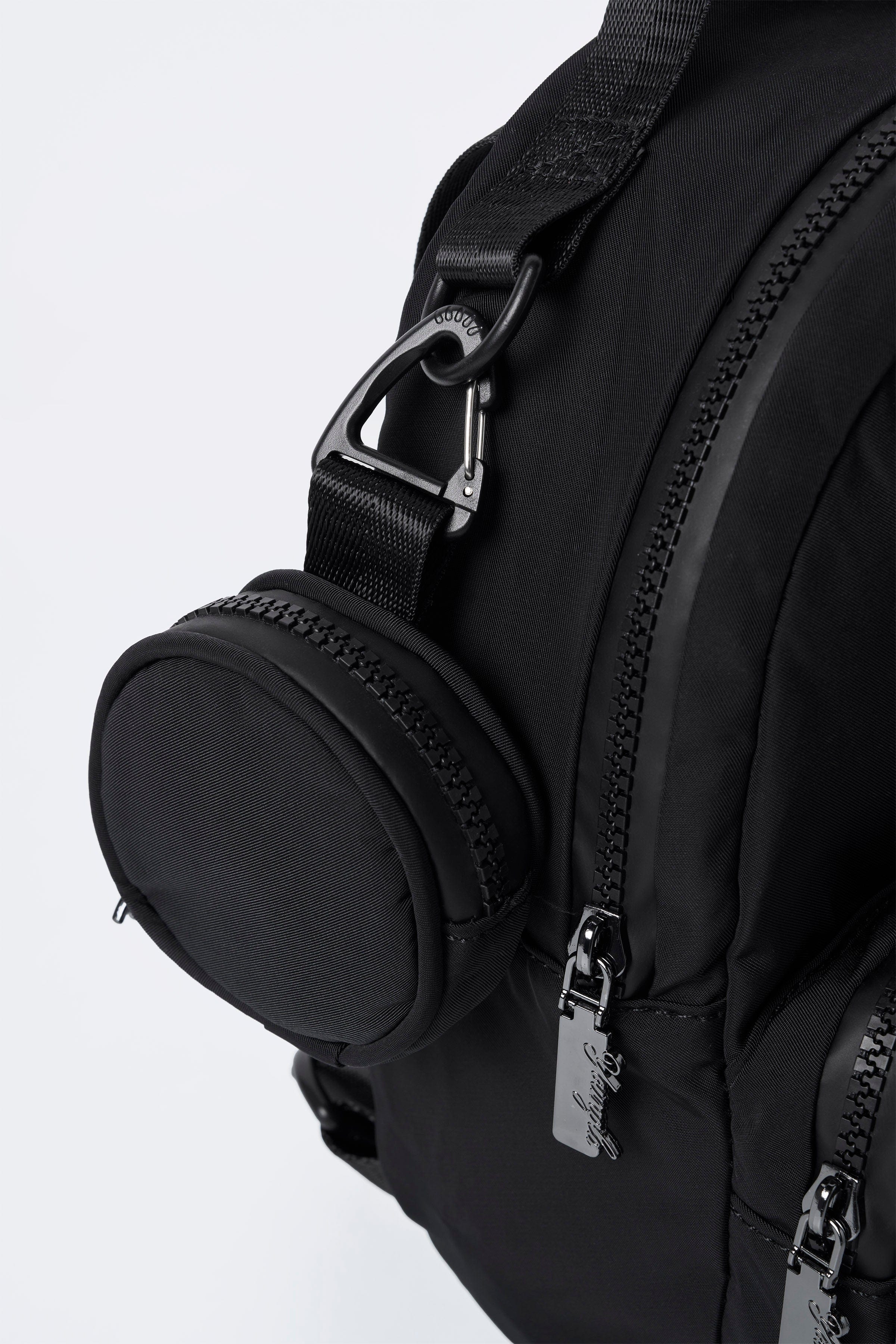 Front view of compact backpack worn by traveler in Memphis street