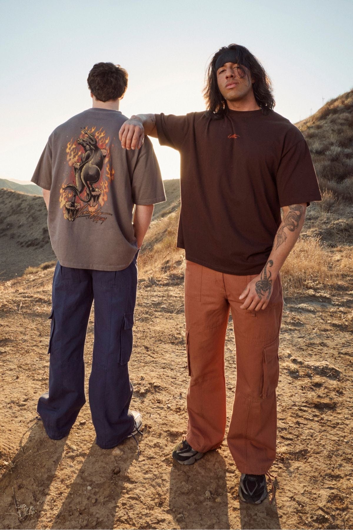 Model pairing cargos with streetwear hoodies for casual urban look