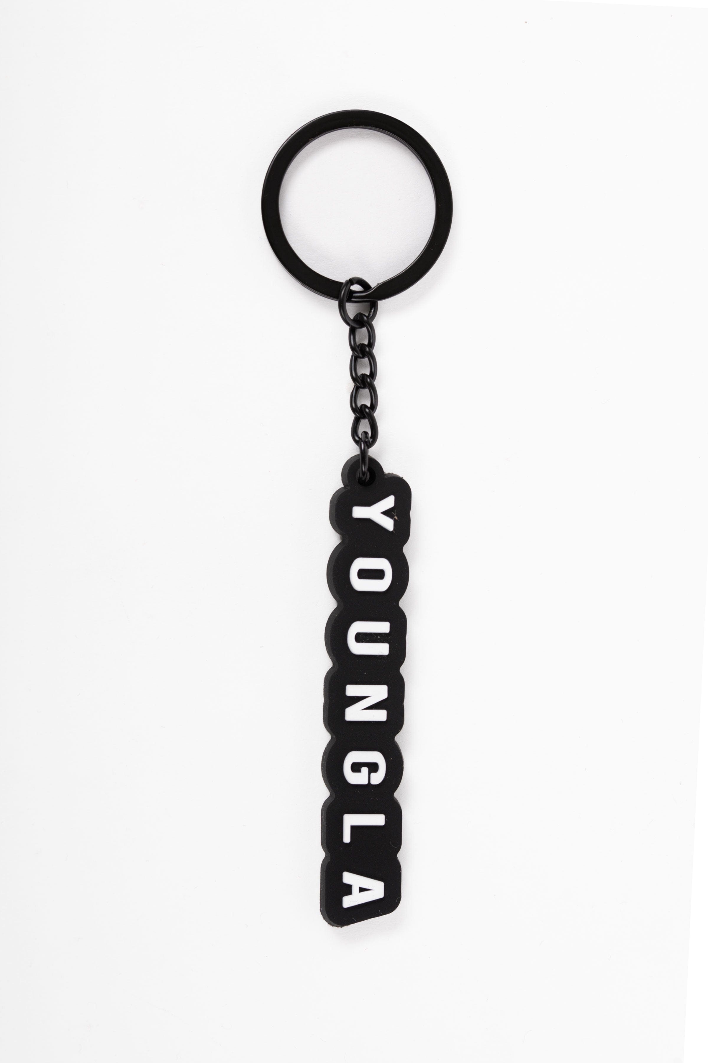 Close-up of YoungLA key holder with keys attached, showcasing minimalist design.